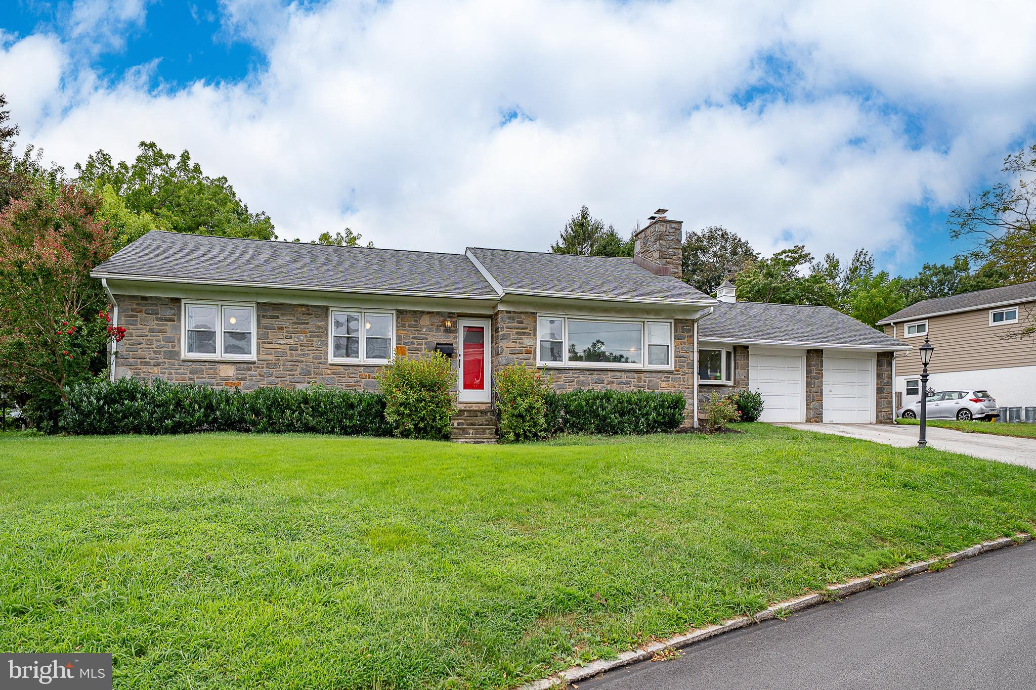 180 School Street is a well-maintained corner-lot ranch home situated on a quiet street in desirable Bala Cynwyd. The home offers three bedrooms on the main level and three full bathrooms total, along with a fully finished lower level providing substantial additional living space and a rare oversized two-car garage a notable feature for the neighborhood. The main level features a bright living room with abundant natural light and a gas fireplace, flowing into a formal dining area with large windows, ideal for entertaining. The updated eat-in kitchen includes new flooring, new appliances, freshly painted cabinetry, and ample storage. A versatile sitting room off the main living area features recessed lighting and a stone accent wall, making it ideal for a home office, media room, playroom, or additional living space. Also on the main level are two guest bedrooms, a full hall bathroom with tub, and a primary bedroom with an en-suite bathroom and step-in shower. The fully finished lower level offers flexible space for entertaining, a home gym, or extended living use and includes a built-in bar area, a third full bathroom with step-in shower, a dedicated cedar closet, an additional storage room, and a washer and dryer. Recent improvements include a newer roof, new refrigerator and oven, updated electrical, new A/C system, new water heater, new boiler, and a well-maintained lawn with landscaping. Located in the award-winning Lower Merion School District, with convenient access to Center City Philadelphia, major highways, and the Main Line’s shopping and dining.