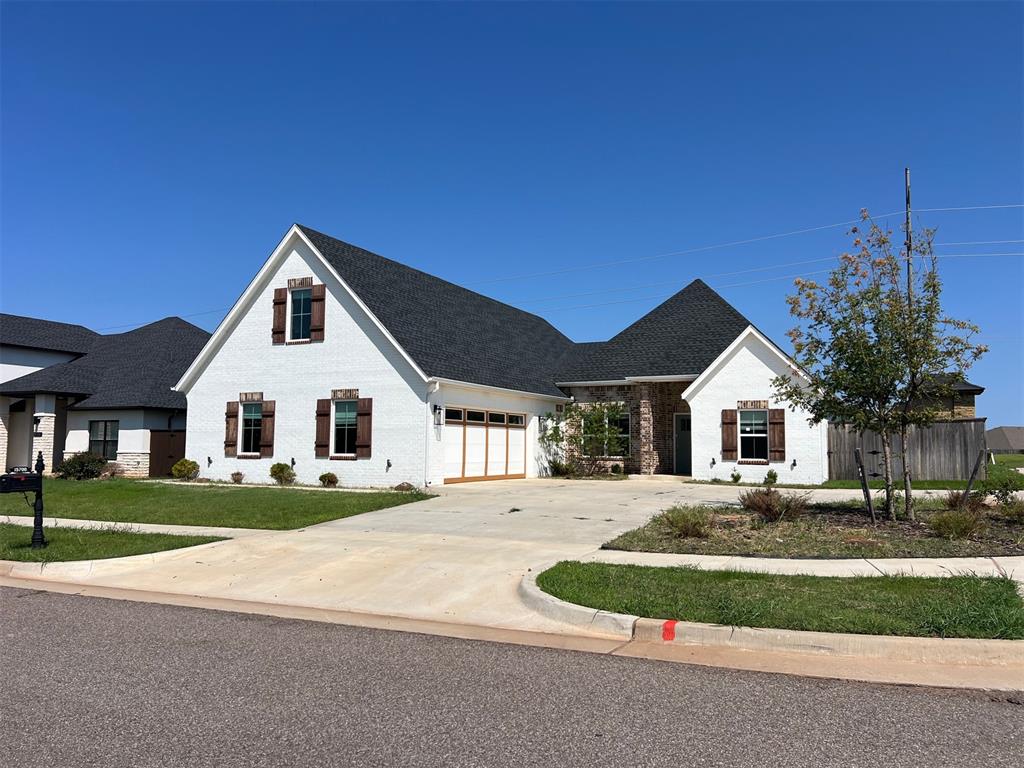 Stunning Modern Home with English Charm in Coveted Deer Creek Schools! Built in 2023, open-concept living, dining, and kitchen area adorned with wood-look ceramic tile floors and abundant natural light. The flexible layout offers 4 bedrooms + office. The gourmet kitchen is a showstopper, complete with a large island and breakfast bar, quartz countertops, stainless appliances, a gas cooktop, beautiful backsplash, and a massive walk-in pantry. A custom buffet cabinet with glass-front doors provides even more storage and style. The downstairs layout features a spacious primary suite with abundant natural light, a luxurious bath with dual sinks, quartz counters, a large walk-in shower, & huge walk-in closet. Just off the closet is a bonus area with built-ins; ideal for a small workspace or extra storage. A split floor plan offers privacy, with two additional bedrooms and a shared bath tucked behind French doors. Upstairs is a large bonus room with a full bath and closet serves as a fourth bedroom, game room, or second living space. Additional highlights include: Drop zone of garage entry, large laundry with utility sink, countertops, & washer & dryer included. Covered back patio and spacious, fully fenced backyard, storm shelter, sprinkler system, and exterior lighting. Neighborhood includes a pool, park, greenbelt & basketball court, and just minutes from top-rated Deer Creek schools and the Kilpatrick Turnpike for easy access across the OKC metro area. Priced right and a must see!