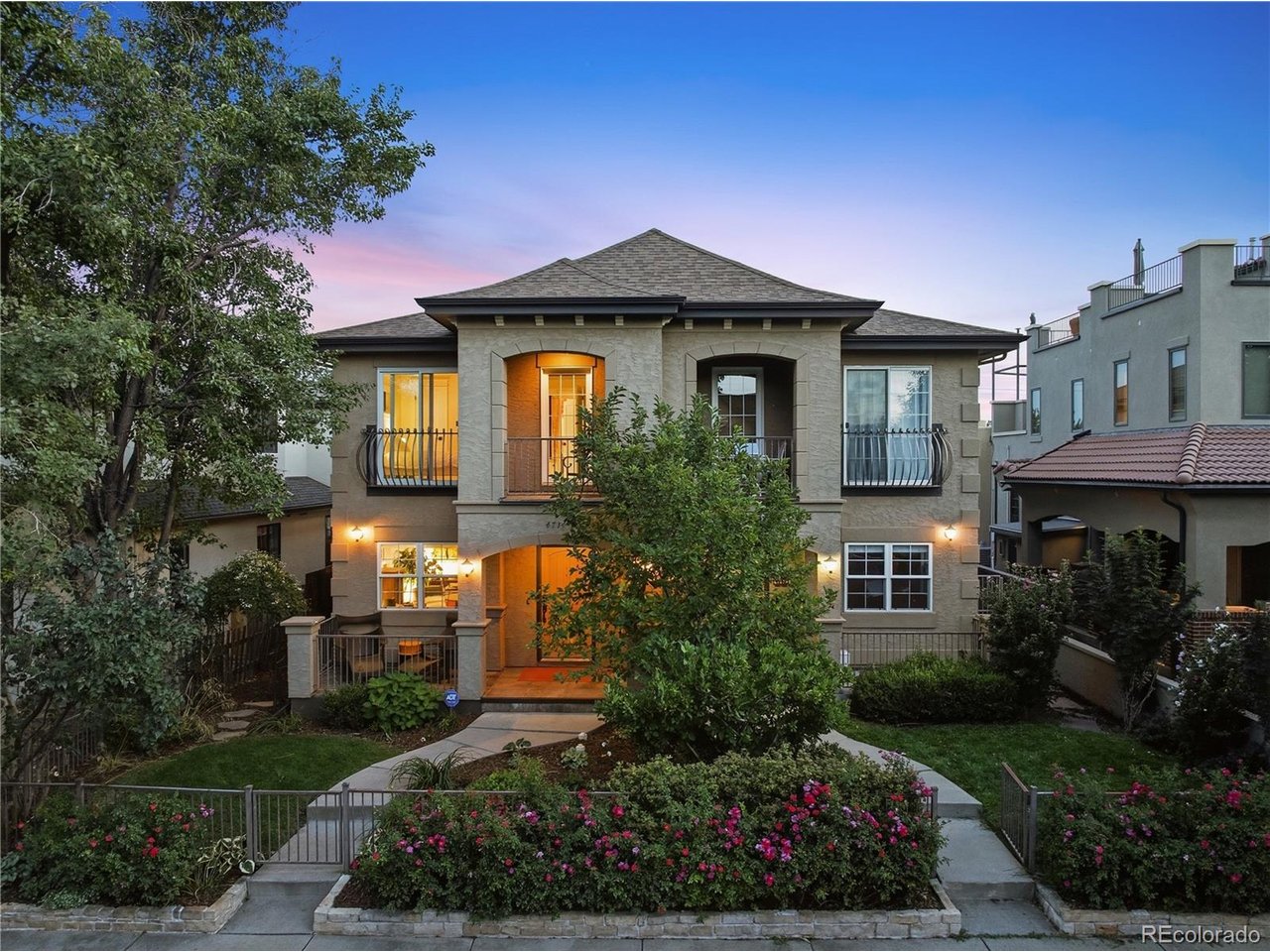 Welcome to this fully renovated Upper Highlands gem offering over 3,300 square feet, 5 bedrooms, 4 bathrooms, a rare 3-car tandem garage, and stunning Front Range views. Ideally located steps from Pferdesteller Park and minutes from Sloan's Lake, Highland Square, Edgewater, and the Tennyson Street district, this exceptional half-duplex lives like a luxury single-family home.More than $300,000 in comprehensive interior and exterior improvements have been completed in the past nine months, creating an elevated blend of craftsmanship, design, and technology. Highlights include refinished hickory hardwood floors, designer Timorous Beasties wallpaper, custom metal stair railings, new Tahiti Beach Sand carpeting, designer lighting, and thoughtfully curated finishes throughout. The chef's kitchen features new Kitchen Craft cabinetry, imported Italian backsplash tile, Caesarstone waterfall countertops, a built-in appliance garage, and new stainless-steel appliances, including an LG cooktop and refrigerator. The adjoining family room is anchored by a custom stone fireplace mantel, while the dining room features hickory ceiling beams and a dramatic Forestier Paris Gravity light fixture. Spa-inspired bathrooms showcase Nero tile flooring, Restoration Hardware vanities, illuminated mirrors, black wainscoting, and sophisticated fixtures. The primary suite features a floating soaking tub and beautiful mountain views. Integrated Precision Media A/V, wireless Sonos audio, built-in TVs, ADT security, and Google cameras complete this sophisticated, move-in-ready home. Outdoor improvements further enhance the property's exceptional turnkey appeal and indoor-outdoor lifestyle. Offered at $1,550,000, or $1,650,000 fully turn-key with more than $180,000 in curated furnishings, artwork, TVs, and audio equipment from Room & Board, Arhaus, Restoration Hardware, and more-a rare opportunity to purchase a beautifully finished home ready to enjoy from day one in a prime Denver location.