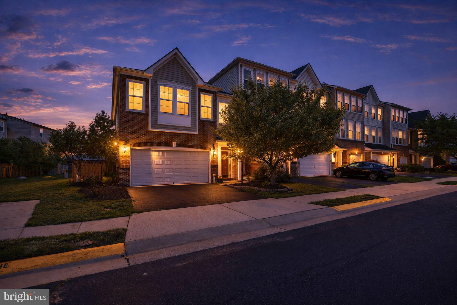 Welcome to South Ridge South, one of  Loudoun's  most sought‑after communities. This End Unit offers exceptional privacy and curb appeal with a professionally landscaped, extensive yard that wraps around the home. Enjoy main‑level living featuring a spacious bedroom and an ensuite, upgraded kitchen cabinets, real hardwood floors, a powder room, and a cozy fireplace — with walk out sliding doors that open to your patio perfect for effortless comfort and entertaining. Upstairs, the upper level opens to a large entertainment area, ideal for gatherings or relaxation. You’ll find three additional bedrooms and two full baths, providing ample space for family and guests. The home also includes an oversized two‑car garage plus driveway parking, ensuring convenience and flexibility.This South Ridge gem combines elegant design, thoughtful upgrades, and a prime location — a rare opportunity for refined living in Vienna.