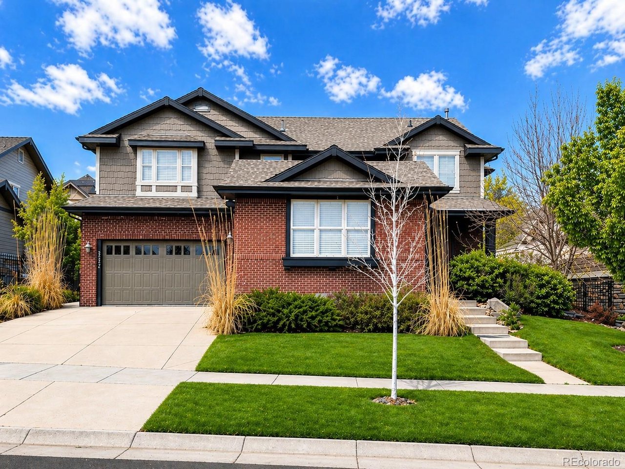 Experience elevated living in this beautifully appointed home within the sought-after Blackstone Country Club community. Ideally positioned off the main road on a quiet, tree-lined street, the setting offers both privacy and timeless neighborhood charm. Spanning 5,541 total sq ft (3,837 finished), the residence features 4 bedrooms, 4 baths, a loft, and a main floor office. A dramatic two-story foyer with an open staircase creates an immediate sense of space and elegance. At the heart of the home, the chef's kitchen showcases dual islands, abundant cabinetry, and GE Monogram appliances. Thoughtfully designed for gathering and connection. A dedicated bar area with sink and beverage fridge adds convenience, while a sliding glass door opens to a covered patio with a built-in grill and gas firepit. Designed for effortless entertaining, the open-concept layout and seamless indoor-outdoor flow create an ideal setting for hosting. From intimate evenings to larger gatherings. Hardwood floors, and four fireplaces bring warmth throughout. Upstairs, the vaulted primary suite offers a private retreat with its own fireplace and dual walk-in closets. The five-piece bath features a walk-in glass shower, separate vanities, soaking tub, and private water closet. A secondary en-suite bedroom is ideal for guests, while the third and fourth bedrooms share a Jack-and-Jill bath. The loft adds flexible living space. The 1,704 sq ft unfinished basement with high ceilings offers endless potential. Complete with a 3-car garage, residents enjoy Blackstone Country Club amenities including golf, dining, fitness center, pool, tennis, pickleball, and year-round events-delivering a truly elevated lifestyle.