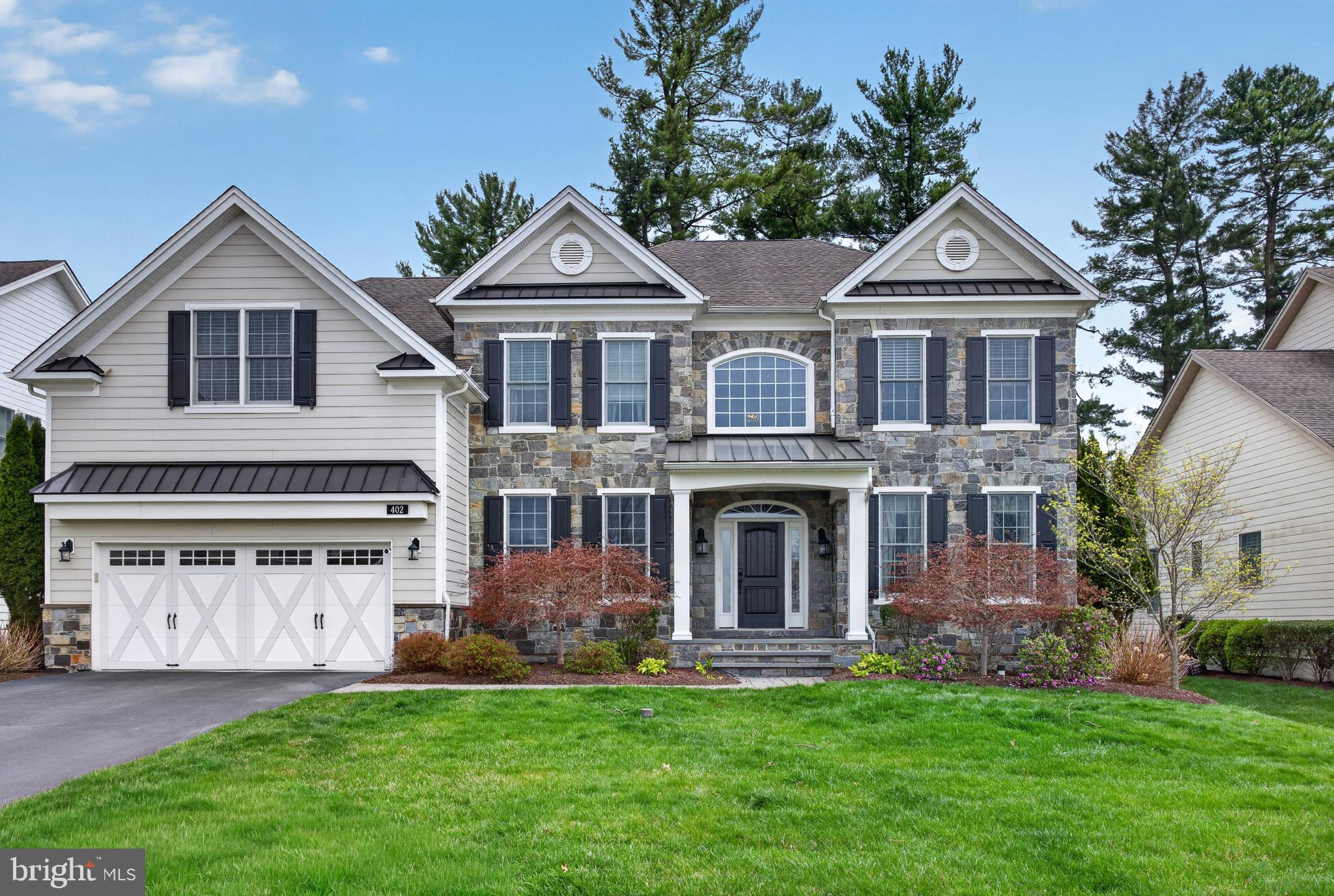 Welcome to this exceptional 5-bedroom, 4.5-bath single-family home located in the highly sought-after Liseter community, where luxury living meets low-maintenance convenience and breathtaking surroundings.From the moment you arrive, you’ll be captivated not only by the home’s elegant design, but by one of its most standout features—a spectacular, unobstructed view of the community pavilion and surrounding park. This premium setting offers a serene, picturesque backdrop that can be enjoyed year-round from the comfort of your own home and spacious rear deck.Step inside to a dramatic two-story foyer and rich hardwood flooring that flows throughout the main level. The expanded great room serves as the centerpiece of the home, highlighted by a stunning floor-to-ceiling stone fireplace and enhanced with upgraded lighting and custom paint, creating a warm yet sophisticated atmosphere. The open floor plan is filled with abundant natural light, perfect for both everyday living and entertaining.The main level also features a spacious formal dining room, a private office, and a powder room. The gourmet kitchen is beautifully appointed with quartz countertops, stainless steel appliances, a large pantry, and an oversized island with breakfast bar seating. The adjoining breakfast room, complete with a skylight, opens through French doors to the rear deck—perfect for taking in those incredible park views. A well-designed mudroom, laundry room with exterior access, and entry to the two-car garage add convenience and functionality.Upstairs, the luxurious primary suite offers a true retreat, featuring a spacious sitting area/den, a custom California Closet system, and a spa-like bath with soaking tub, glass-enclosed tile shower, private water closet, and dual vanities. A princess suite with its own full bath, along with two additional generously sized bedrooms sharing a hall bath, complete the upper level. Thoughtful upgrades include multiple California Closet installations throughout the home—including in the basement, pantry, upstairs hall closets, mudroom, additional bedroom, and primary suite—providing exceptional organization and storage.The fully finished lower level expands your living space with a large game room, additional bedroom, full bathroom with tile and glass shower, a kitchenette area, and a mirrored exercise room—ideal for guests, entertaining, or multi-generational living.Enjoy truly maintenance-free living, as the community takes care of landscaping and lawn care. Liseter offers an unmatched lifestyle with resort-style amenities including an outdoor pool, clubhouse, fitness center, tennis and basketball courts, and over 5 miles of scenic walking and biking trails. Surrounded by hundreds of acres of preserved open space, as well as beautifully maintained grounds with a pavilion and gazebo, this community blends luxury with nature.This is a rare opportunity to own a beautifully upgraded home in one of the area’s most desirable communities—schedule your private tour today!