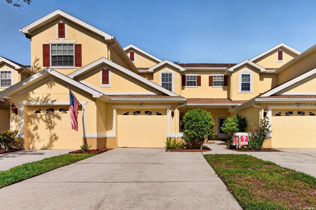 Virtually Staged. Looking for a move-in ready, newer home in a sought after gated community? Look no more! This beautiful Tarpon Springs townhome sits on a street with sparse traffic in a NON flood zone. Home offers a bright, open plan with high ceilings and includes the following: covered front porch, welcoming foyer, spacious living and dining areas, eat-in kitchen with breakfast bar, large master suite with private bath & walk-in closet, office or guest bedroom, upstairs full bath, separate laundry room, ground floor powder room, screened lanai, rear paved patio, garage, AND 2-car driveway. The abundant ground floor living spaces, screened porch, and paved patio make this home PERFECT for entertaining! Enjoy your morning coffee & evening glass of wine in a peaceful outdoor setting. Property also features the following updates, KITCHEN: granite counters with 4" backsplash, stainless farm sink, faucet, and appliances with stainless steel fridge & dishwasher, BATHROOMS: granite counters, faucets, toilets, showerheads, tub enclosure, and shower enclosure with glass door, INTERIOR: new carpet & luxury vinyl flooring (2026), ceiling fans, light fixtures, Master BR modular walk-in closet system, water heater (2022), PLUS a newer A/C system (2023). The HOA takes care of exterior maintenance including the roof, paint, and lawn care. They recently resurfaced the community pool, built a new dock, and resurfaced the roads. Townhomes at North Lake is a meticulously maintained, tropically landscaped, lakefront community with mature plants, shrubs, palms, majestic trees, and lush green lawns. Amenities include: nicely paved gated entry, fenced common areas, private mailboxes, sidewalks, guest parking spots, and a tranquil recreation area with refreshing lakefront pool and new fishing dock ON Salt Lake. It is ideally located just off the beaten path yet near everything! For bicyclists, the Pinellas Trail extension is adjacent to the community. A short drive away is Lake Tarpon, several shopping hubs, countless restaurants, historic downtown Tarpon Springs along with its famous Sponge Docks, and the sandy beaches of Howard Park. This is a MUST SEE for buyers seeking a move-in ready, maintenance free townhome in a gated community. PLEASE NOTE: this home is being offered under recent appraised value.