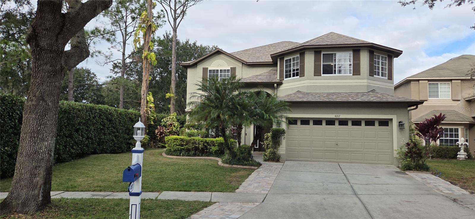 PROFESSIONAL PHOTOS COMING! Welcome to your dream home in the highly sought-after Heritage Harbor community! This impressive 6-bedroom, 3-bath saltwater pool home boasts a premium location on the first tee of the golf course, offering side water views, a spacious corner lot, and ultimate privacy with only one neighbor. Set on a cul-de-sac, this home provides the perfect blend of luxury, comfort, & convenience. Families will appreciate the home’s proximity to some of the best education in the area. All three US News Award-Winning schools—elementary, middle, and high—are located together on a picturesque campus less than two miles from your doorstep. As you approach, you're welcomed by a lovely landscaped front yard that sets the tone for the elegance found within. The expansive, private paver lanai features a beautiful saltwater pool with therapeutic jets & bench seating, a screen enclosure (2017), & panoramic views of both the tranquil pond and the vibrant golf course. Elegant Interior features soaring ceilings & luxury flooring.  Step inside to find high beautiful marble flooring, creating a bright and airy ambiance throughout the main living areas. The dining room, adjacent to the front living room, is graced with expansive windows, offering an abundance of natural light. The gourmet eat-in kitchen features granite counters, an island, breakfast bar, stainless-steel appliances, closet pantry, & ample cabinetry—this kitchen opens to a spacious family room with hardwood floors & a cozy wood-burning fireplace. The main floor guest suite offers a generous bedroom that is perfect for guests, complemented by an updated bathroom featuring a contemporary vanity and tile backsplash. Ascend the staircase adorned with newer carpeting to reach the expansive upper level, where the master suite & four inviting guest bedrooms await. The master suite impresses with its generous proportions, highlighted by laminate flooring and a recently installed fan. Step into the luxurious master bath, to include dual vanities for ample space, a garden tub for soaking, a separate tiled shower, and a spacious walk-in closet. This home features four generously sized guest bedrooms. Among these, one standout bedroom boasts an elegant double-door entry. The third bathroom has been tastefully updated. All the additional bedrooms also benefit from newly installed carpeting. Step out back to your private, expansive lanai to cool off in the saltwater pool or simply unwind while enjoying the peaceful pond views and the excitement of golfers teeing off nearby. Other amazing features include… Roof 2020, both A/C’s replaced in 2018 & 2019, front door 2016, updated water heater, remote control fans, newer oven & microwave, water softener, newer exterior paint, newer carpet in most bedrooms, & a Tesla charging station in the garage. This home is close walking distance to the pool & all Heritage Harbor amenities. Heritage Harbor offers residents can enjoy the 11,000 square-foot Clubhouse featuring a fully equipped fitness center, a dedicated after-school/summer camp program, a library, and activity center for all ages. Pre-school programs are nearby. Equipped with a playground, a quarter-acre swimming pool with a 50-foot, three-story water slide, 4 tennis courts, a sand volleyball court, basketball hoops, an outdoor rollerblading rink & golfers will delight in the Heritage Harbor Golf Course, a par-72, 6,900-yard course. Prime location, just minutes to the Suncoast Parkway.