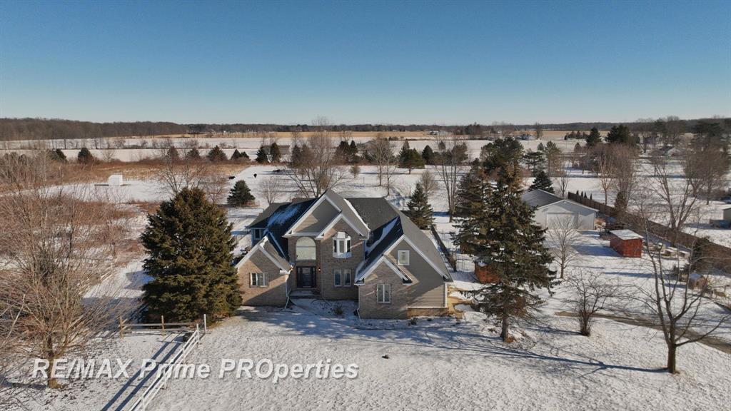 Bring the horses and animals; this exceptional property is ideal for the hobby farmer or animal enthusiast. Designed for country living, the just over 10 acres offers multiple fenced pastures (2021-2025), a pond, walking paths, raised garden beds, horse lean-tos, and a 30x40 pole barn with stalls-perfect for livestock and outdoor pursuits. Inside, a grand foyer welcomes you to over 2,800 sq. ft. featuring 4 bedrooms and 2.2 baths, Brazilian hardwood floors, and a chef's kitchen with granite countertops and stainless steel appliances. The open layout is perfect for entertaining, highlighted by a stone fireplace and floor-to-ceiling windows with peaceful views. The primary suite includes a sitting area and spa-like bath with double granite vanity, jacuzzi tub, and walk-in stone shower. Enjoy added convenience with upstairs laundry and a main-level therapeutic walk-in tub. Outdoor living shines with a heated in-ground pool, pool house, and built-in grill. Too many features to list-ask your Realtor for additional highlights of this truly special property.