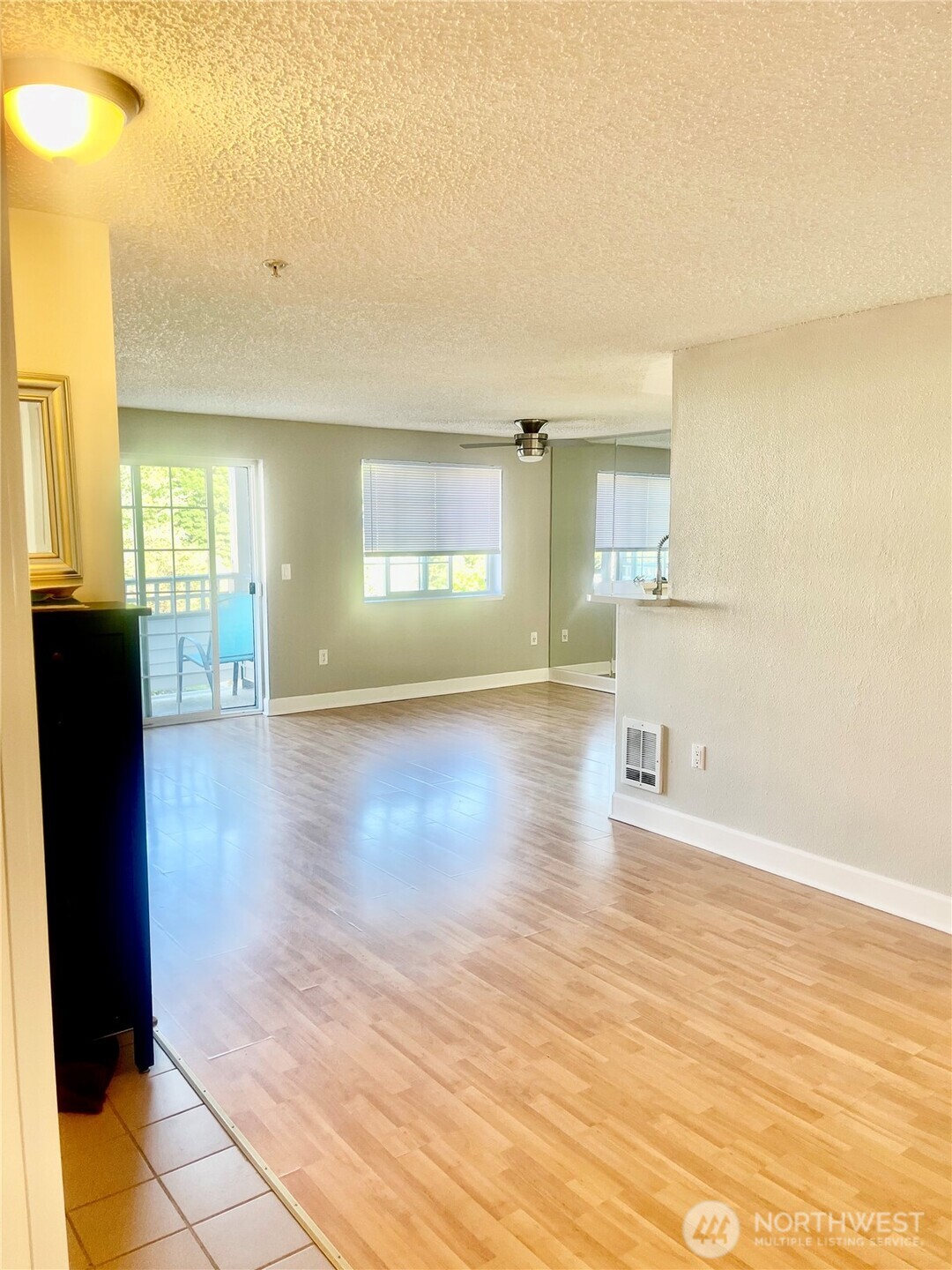 Make this three-bedroom, two-bathroom condo yours. Spanning 1,065 square feet, it features a kitchen and dining area that open onto the living room, creating an ideal space for entertaining. It offers easy access and is situated close to schools, bus routes, and shopping centers, as well as just minutes away from highways and other amenities.