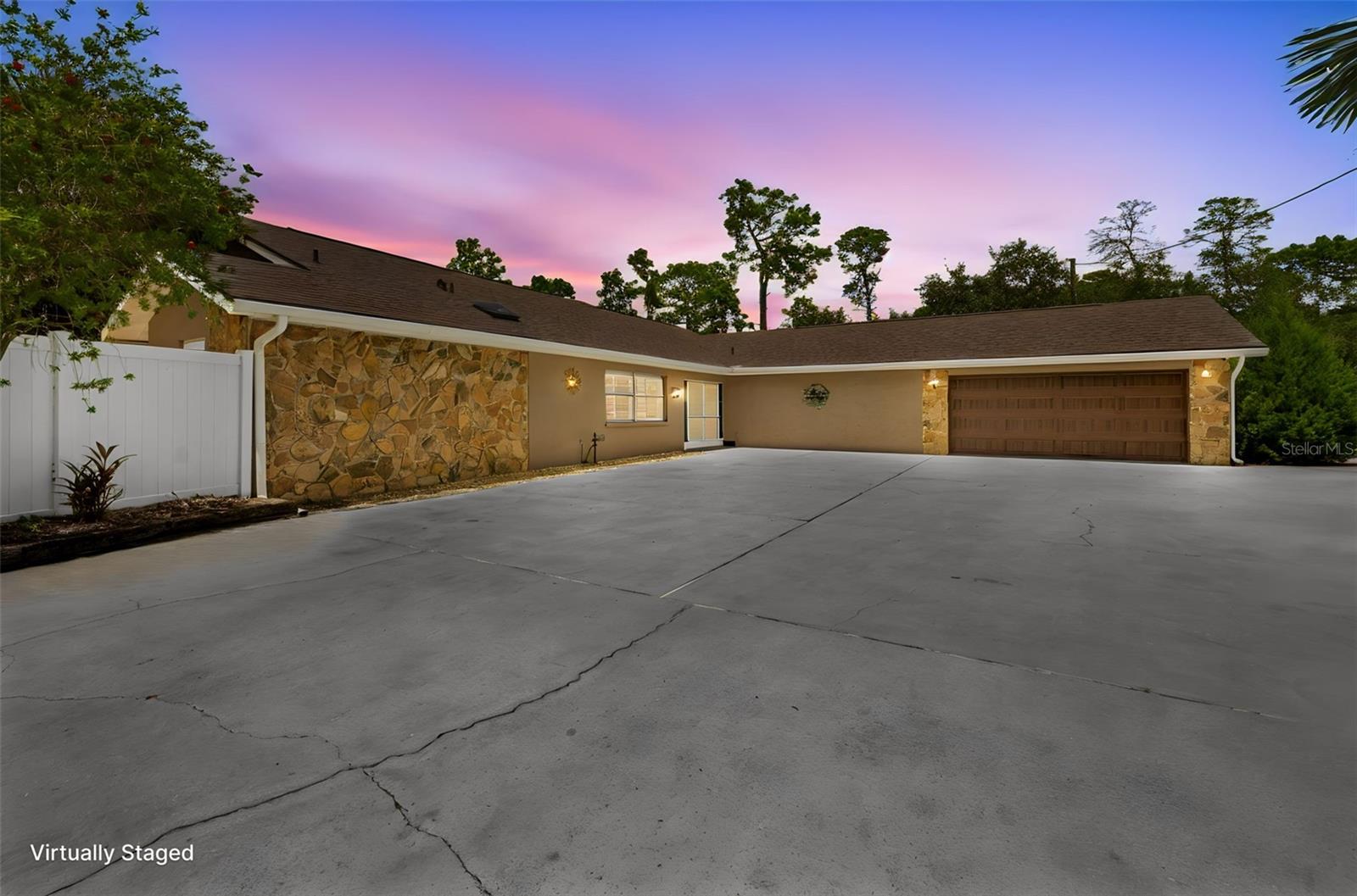 This unique property is now on the market and leaves little to be desired! You will not find many homes like this in the Spring Hill area. Do you love the Spring Hill area, all the amenities it has to offer but also want acreage? Look no further! Do you need a spot for your rv, toys, guest house or in law suite? This home sits on a beautiful 2.5 acres. As you enter the property you have a long circle driveway. The main home offers 3 bedrooms and 2.5 bathrooms. The kitchen has been updated with granite counters and wood cabinets. Inside you'll have a nice open concept with the kitchen overlooking the main living area. Take a walk down the hall where you'll find a large second family room/game room. It has a spacious master bedroom and master bath including a big tiled shower, tub, and double vanity. Walk out the glass sliders to the amazing pool area with covered patio, great for entertaining. Take the paver sidewalk from there to the fire pit, perfect for those evening gatherings. The majority of the property is already chain linked around the perimeter. As you walk the property you notice all the landscaping, including some large bizmark palms. The yard also includes an irrigation system keeping the grass beautiful and green. Keep walking toward the south side of the property where you'll find a 30x60ft metal building for all your storage needs or whatever hobby you may have. The metal building is equipped with an oversized door to fit your boat or RV. Approximately 1200sqft of this building which includes an upstairs is climate controlled with a full bathroom and living quarters perfect for a guest house or in law suite. The pool was resurfaced and updated with pavers 2019. The detached metal garage 2023, new roof 2021, AC 2017. This home has a lot to offer and a rare find so call while it lasts!