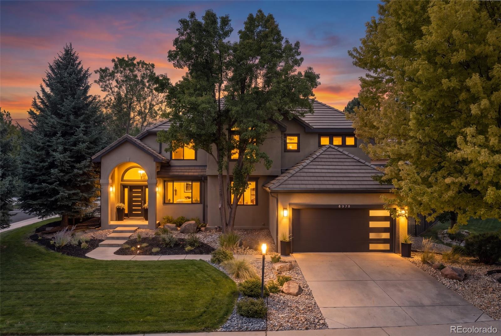 Welcome to this beautifully updated home, tucked behind the gates of prestigious Heritage Hills. Situated on a desirable corner lot with mature landscaping, this inviting residence blends modern style, thoughtful upgrades, and comfortable everyday living.Step inside to a bright, welcoming interior featuring fresh paint, new carpeting, and extensive lighting upgrades, including LED can lights, under-cabinet and closet lighting, and stylish chandeliers. Lutron smart shades, plantation shutters, Roman shades, and modern ceiling fans add comfort and convenience throughout.The beautifully updated kitchen is designed for both everyday living and entertaining, with contemporary finishes and newer appliances. A private main-level office provides an ideal work-from-home space.Upstairs, the spacious primary suite features vaulted ceilings, a generous walk-in closet, and a beautiful ensuite bath with a spa-like feel. Two additional bedrooms, a full bath, and a large loft offer flexible space for guests, family, or a second living area.The finished basement expands the living space with engineered hardwood flooring, a spacious media or flex area, additional bedroom, full bath, and abundant storage.The finished three-car tandem garage is a standout feature, complete with epoxy flooring, custom cabinetry, butcher-block workbench, safe, and accessible attic storage. Additional improvements include new windows, front and garage doors, oversized gutters with gutter guards, exterior lighting, window-well covers, and a whole-house surge protector.Outside, enjoy the mature landscaping and established corner-lot setting. Heritage Hills offers two community pools, tennis and pickleball courts, playgrounds, and beautifully maintained neighborhood amenities. Conveniently located near C-470, DTC, Park Meadows, hospitals, shopping, dining, and entertainment, this exceptional home offers the perfect combination of comfort, style, and location.