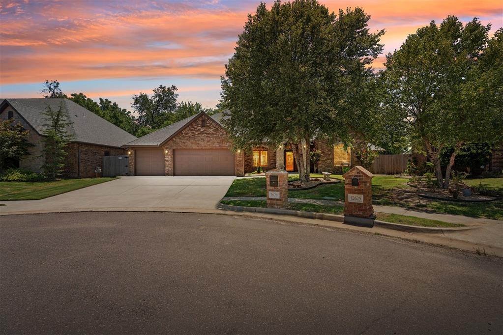 Beautifully maintained and thoughtfully designed, this custom one-story home for sale in Oklahoma City, OK—built by Mike Metcalf Construction, LLC—is located in the highly sought-after Rockport Addition. Offering the perfect blend of luxury, comfort, and peace of mind, this move-in ready home is just minutes from I-44 and within walking distance to South Lake Elementary School, making it ideal for families, professionals, and relocation buyers seeking convenience and quality living in OKC.This spacious 4-bedroom home located in the Moore school district features a versatile bonus room and a dedicated home office, providing flexible space for work, play, or guests. The open-concept living area showcases a stunning fireplace, rich wood flooring, and large windows that flood the home with natural light. A formal dining room with a built-in coffee bar flows seamlessly into the open kitchen, which is equipped with granite countertops, double ovens, black stainless-steel appliances, a 5-burner gas cooktop, and generous counter and storage space—perfect for everyday living and entertaining.The private primary suite offers a relaxing retreat with dual vanities, a soaking tub, a separate walk-in shower, and a large walk-in closet. Step outside to enjoy Oklahoma outdoor living with a covered patio, mature trees, firepit, and a fully landscaped yard with sprinkler system—ideal for entertaining or quiet evenings at home.Exceptional upgrades and peace-of-mind features include a 6-person in-ground storm shelter, Generac whole-house generator, Level 2 EV charging station in the garage, tankless hot water heater, backyard storage shed, and a durable polyaspartic garage floor coating.This one-story OKC home for sale truly delivers luxury living, a prime location, and lasting value in one of OKC’s most desirable neighborhoods. Don’t miss your opportunity to own this exceptional home in Rockport Addition!