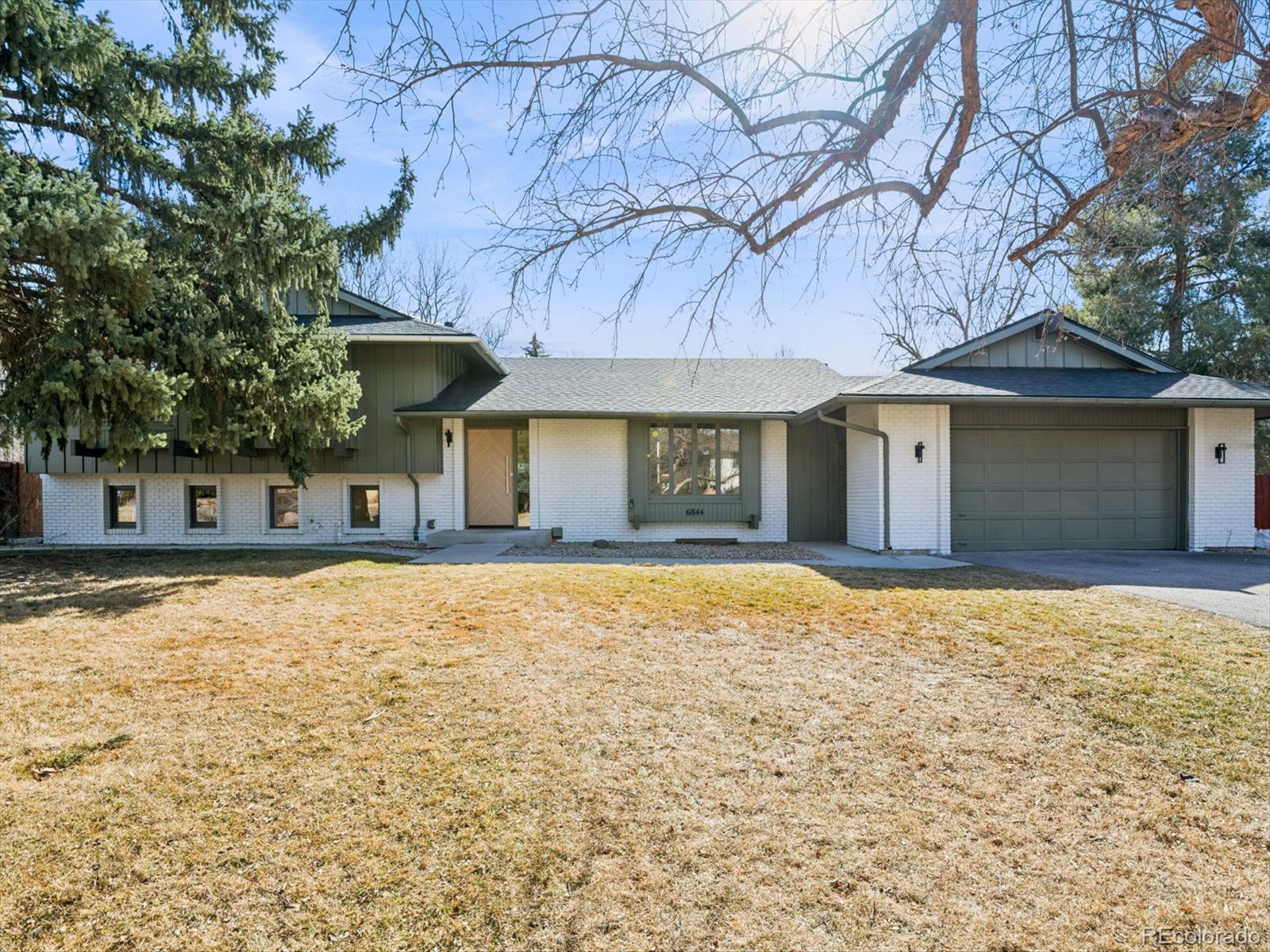 Set within the highly sought after Boulder Country club community, this fully renovated 4 bed, 4 Bath residence blends warm, refined elegance with a sophisticated contemporary aesthetic. From the moment you step inside, the open great room and Chef's kitchen make a striking impression with vaulted ceilings, custom wood beams, fireplace, and wide planked hardwoods throughout. Thoughtful design details elevates the space, including a charming window seat, and an expansive walk-in pantry, outfitted with an abundance of custom cabinetry, Quartz countertops, and a Miele Coffee Station! The heart of the home is the Chefs kitchen and adjacent eat-in dining area, designed for both everyday living and effortless entertaining. Anchored by the 48 inch double-oven gas range and a Sub Zero refrigerator, it features a custom built oversized hood, quartz countertops, and crafted cabinetry. An expansive islands seats 4-6, creating the perfect space for gathering family and guests. The primary suite is a true retreat anchored by a tranquil fireplace and charming window seat. A custom walk-in closet-thoughtfully designed with a stackable washer and dryer which adds an exceptional layer of convenience. The spa inspired bath is designed for the most discerning homeowner. Unwind in the soaking tub or enjoy the oversized shower adorned with custom-organic inspired tile and dual shower heads. The bidet/toilet provides virtually every modern feature imaginable. The lower Garden level is ideal for entertaining with a wood burning fireplace, built ins, and a stylish wet bar complete with a wine refrigerator. The Basement level further expands offering an additional living area, with private bedroom, new 1/2 bath. The systems have all been updated, including a high efficiency electric furnace w/heat pump and central air conditioning, a tankless water heater, and a new roof, providing both peace of mind and energy efficiency. The private backyard and patio are great for entertaining.