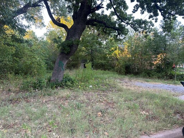 Large 135 ft x 50 ft lot right in the city! This property offers a wooded setting with a natural creek running through the west portion, providing privacy and character. Plenty of space for outdoor projects or creative development opportunities. A rare find with mature trees and natural features in an urban location.