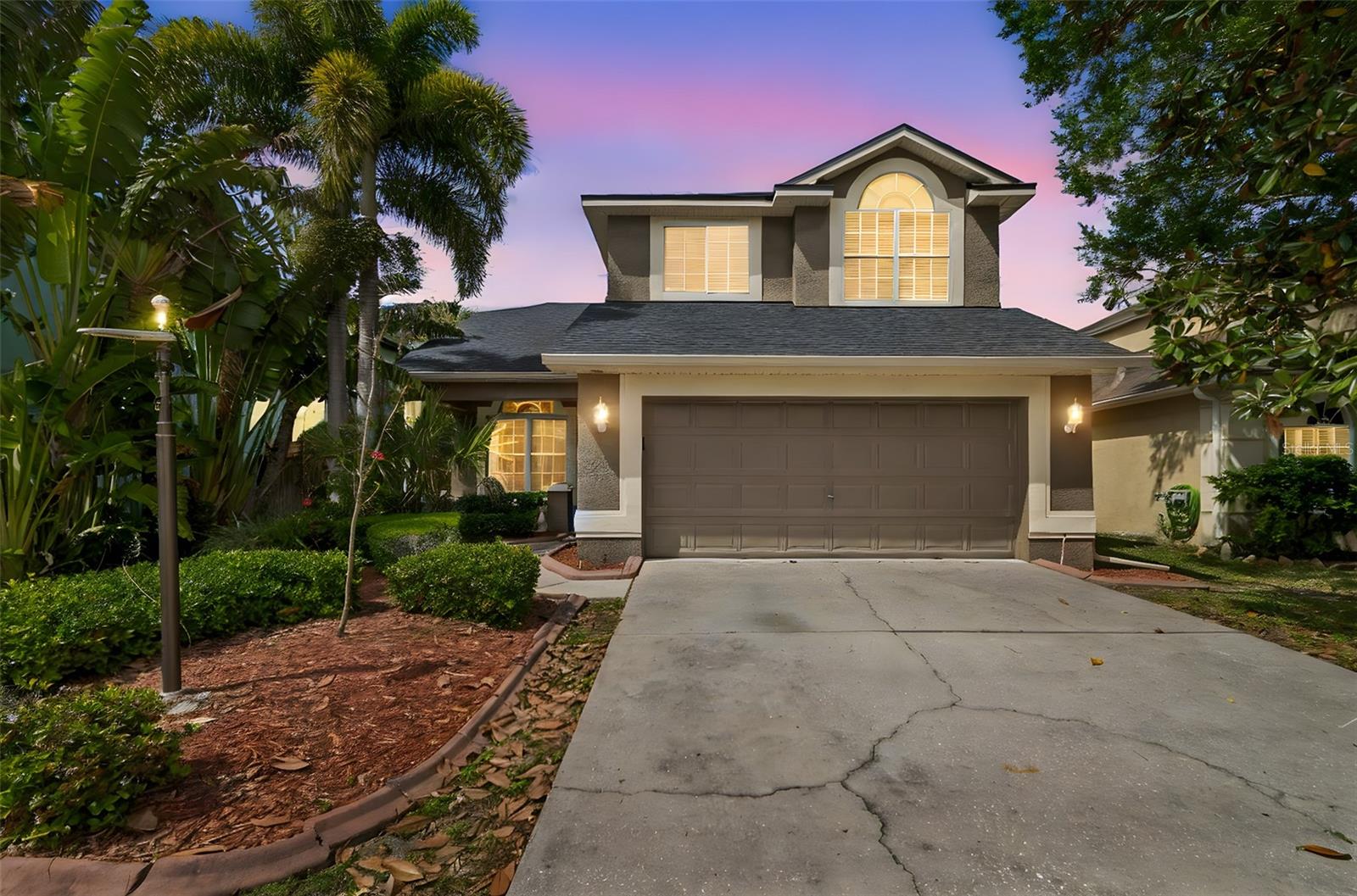 Beautiful 4-bedroom, 2.5 bathroom pool home with 2-car garage located in the highly desirable Grassy Pointe community of Tarpon Springs! This light and bright two-story home features soaring ceilings, large windows bringing in an abundance of natural light, and a spacious open floor plan perfect for entertaining and easy living. The upgraded kitchen offers gorgeous granite countertops, stainless steel appliances, custom cabinetry, and even a built-in wine fridge. Your backyard retreat awaits just off the kitchen, complete with the enclosed, climate-controlled lanai overlooking the sparkling pool and spa. The first-floor primary suite boasts plenty of space with not one but two closets, as well as an ensuite bath complete with dual sinks, a soaking tub, and a separate step-in shower. The guest half bath down the hall and interior laundry both add extra convenience to everyday life. The upstairs features three additional bedrooms and one full bath. Enjoy true piece of mind knowing your "big ticket" items have all been replaced in the last 5 years, including the roof with a 50-year transferrable warranty. Conveniently located just minutes from shopping, dining, parks, the famous Sponge Docks, and more, you don't want to miss this one! Schedule your private showing today!