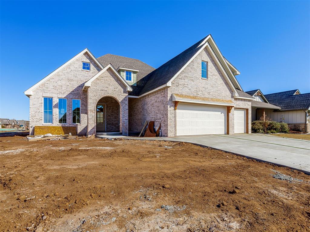 Discover this stunning new construction home located just two miles from campus in the highly desirable Cedar Lane neighborhood. Perfectly positioned on a spacious corner lot, this thoughtfully designed residence offers 5 bedrooms, 3 full bathrooms, and an expansive upstairs bonus room—ideal for a media room, home office, or additional living space.A true centerpiece of the home is the impressive vaulted ceiling in the living room, complemented by a dramatic wall of windows that fills the space with abundant natural light and creates an open, airy atmosphere. The kitchen is designed to impress, featuring a 36-inch range, built-in wall oven and microwave, and an abundance of beautiful quartz countertop space—perfect for both everyday living and entertaining. Ample cabinetry throughout the home ensures exceptional storage, while the oversized utility room and generously sized pantry make organization effortless.Upstairs, you’ll find an additional bathroom and a large bonus room, offering flexibility to suit your lifestyle needs.Currently under construction and slated for completion in April, this home presents a unique opportunity for personalization. There is still time to select your preferred paint colors, backsplash, lighting fixtures, plumbing fixtures, and hardware to truly make this home your own.Don’t miss your chance to own this beautiful, one-of-a-kind property. Contact us today for more information or to schedule a private consultation.