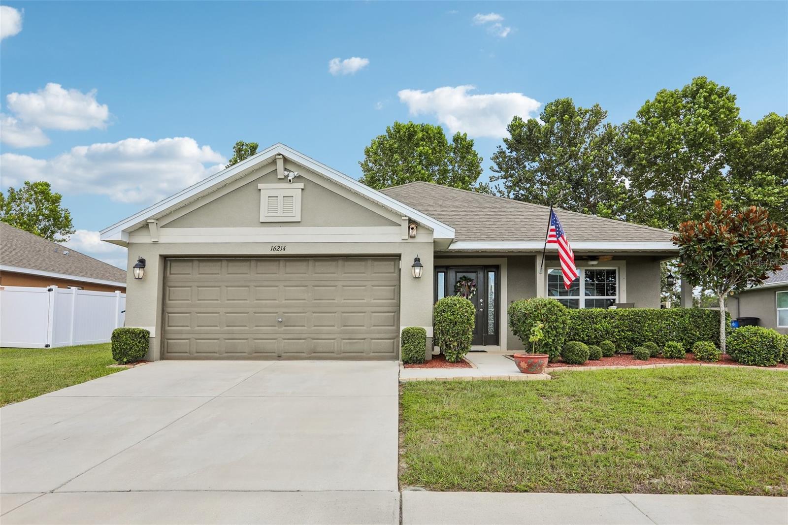 Bright, sun-filled 4-bedroom, 3-bath home in Hudson's Summer Chase community, built in 2019 by Adams Homes and offering the comfort of established construction without the wear of an older home. Set on a generous 70' homesite, the split-bedroom floor plan places the primary suite on its own side of the house, giving everyone in the household genuine separation and quiet, rather than bedrooms stacked one after another down a single hallway. Rooms throughout are sized with intention, and natural light carries through the main living areas for a bright, open feel from the moment you step inside.Every bedroom in the home includes its own walk-in closet, a detail that pays off daily in a full family household getting ready at once, and ceiling fans in each bedroom keep rooms comfortable through Florida's warmer months while easing the load on the air conditioning system. The primary suite's en-suite bathroom is built around real comfort: a garden tub for unwinding at the end of the day, dual sinks that remove the morning bottleneck, and a spacious walk-in closet with room to stay organized. A Jack-and-Jill bathroom serving the secondary bedrooms features a custom walk-in shower, an upgrade well beyond the standard builder finish.Upgraded cabinetry and extended tile flooring through the living areas add a refined, cohesive look that most buyers only find in higher-priced resales, while hurricane shutters, neatly stored in the garage, mean storm preparedness is already handled and ready to deploy over every window when needed. For everyday living, the enclosed and screened lanai extends the home's usable footprint outdoors, with its own ceiling fan keeping the space comfortable for morning coffee, evening relaxation, or entertaining without the interruption of bugs or direct sun.Roof and A/C are original to the 2019 construction, approximately seven years old, well maintained and within typical service life, giving buyers confidence in the home's major systems without a brand-new price tag. Summer Chase sits minutes from Tampa's employment centers, universities, and international airport, with a short drive to Gulf beaches, waterfront dining, shopping, and healthcare, making it a genuinely convenient home base. A 2-car attached garage rounds out the practical features. Schedule a private showing to experience the light, the layout, and the level of finish in person. All offers must include a pre-qualification letter or proof of funds.