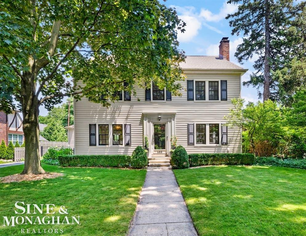 Classic center entrance Colonial ideally located within walking distance to everything-just steps from the residents-only lakefront park, top-rated schools, and perfectly situated between the Village and Hill shopping districts. This home features beautifully refinished hardwood floors throughout the first floor and most of the second floor, adding timeless elegance. Enjoy spacious living and dining rooms with a cozy gas fireplace, a charming library/office, and one of Grosse Pointe City's best screened-in porches. The large master suite offers an updated bathroom and dressing area, while the third floor boasts two additional bedrooms and a renovated bath-perfect for guests or teens. The front showcases new Marvin windows, and the newer kitchen is equipped with high-end appliances and granite countertops, enhancing both style and functionality. A great room and convenient second-floor laundry add to the home's appeal. Gorgeous backyard gardens, brick walkways, and a large patio-paved with historic Detroit street bricks-provide wonderful outdoor entertaining spaces. Additional highlights include a newer roof (approx. 8 years old), Spacepak AC covering most of the home, updated electrical, and exceptional curb appeal. This is truly a must-see property!