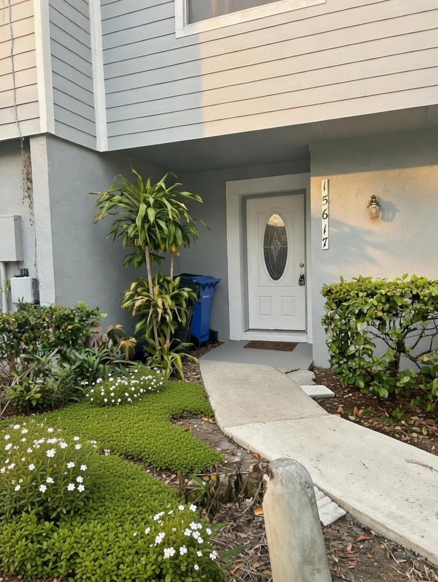 One or more photo(s) has been virtually staged. Welcome to this 3 bedroom, 1.5 bathroom townhome offering comfort, style, and serene water views. The spacious layout allows for entertaining and relaxation! The kitchen offers ample cabinetry and counter space for everyday convenience.  Step outside to your screened-in back porch and unwind while overlooking the tranquil body of water- perfect setting for morning coffee or evening sunsets. The townhome is also located in a subdivision with a community pool, playground, tennis, and basketball courts. This location is just minutes from USF, Busch Gardens, and the VA hospital.