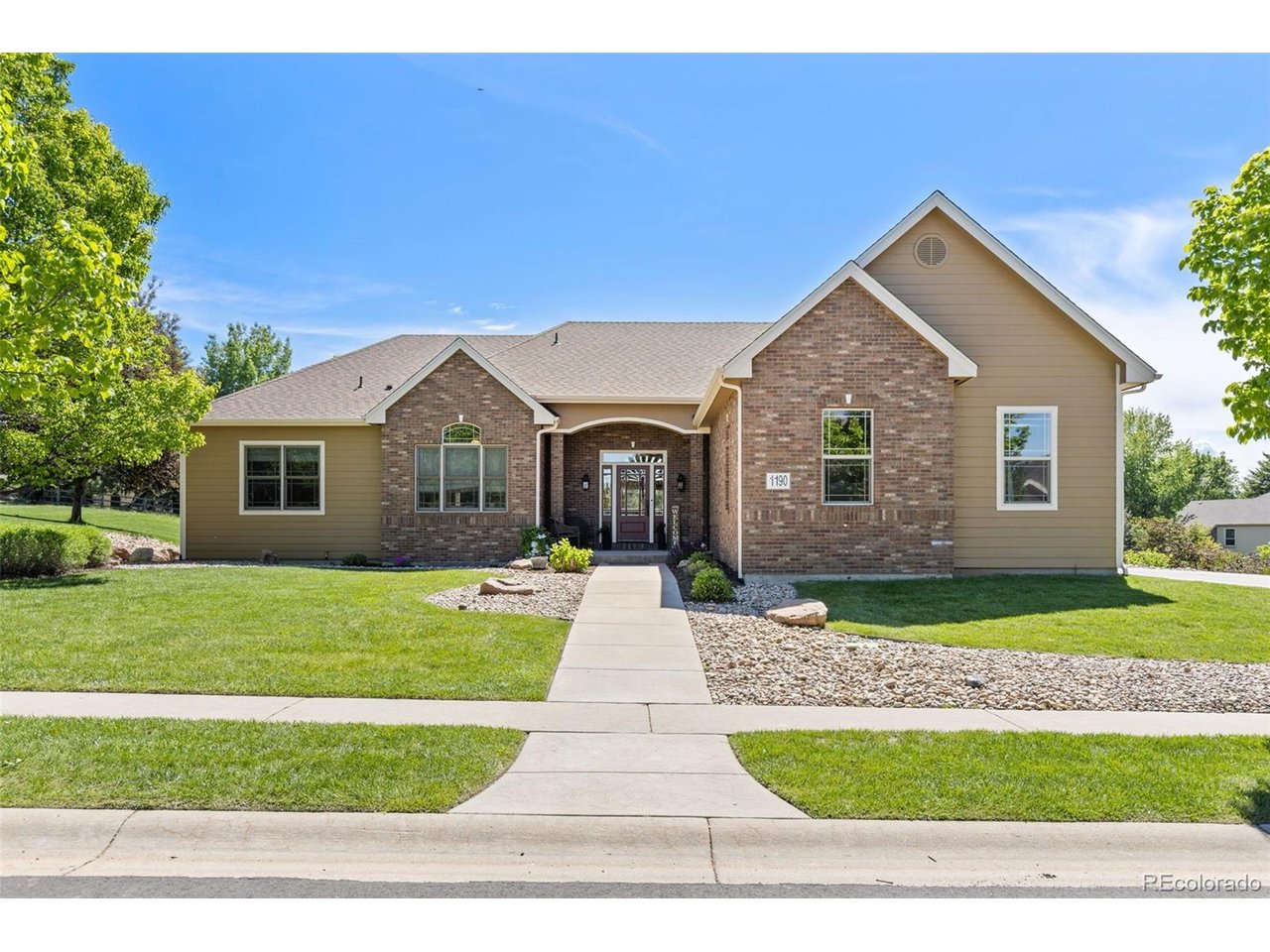 Significant price drop! Sellers are ready for an offer! Tucked at the end of a quiet cul-de-sac in Windsor's sought-after Ridge West neighborhood, this beautiful 5-bedroom, 4-bath ranch-style home offers over 5,200 square feet of living space on a beautifully landscaped 0.45-acre lot backing to open green space-with no metro district. From the moment you step inside, soaring vaulted ceilings, oversized windows, and rich hardwood floors create a bright, open feel. The main living area flows effortlessly into the kitchen, where knotty alder cabinetry, chiseled granite countertops, stainless steel appliances, and double ovens make it ideal for both daily living and entertaining. The main-level primary suite provides a private retreat, while two additional bedrooms with walk-in closets and a shared bathroom offer functional main-floor living. The walk-out basement is designed for gathering, featuring 9-foot ceilings, a spacious recreation area, cozy fireplace, and a full wet bar complete with refrigerator and dishwasher. Two additional bedrooms, a dedicated office or study, and flexible living space make it perfect for guests, hobbies, or multi-generational living. Step outside to enjoy a deck and patio overlooking peaceful green space with foothill and city views. The fenced backyard includes multiple areas created for both relaxation and play. Additional highlights include an oversized 3-car garage and two fireplaces. With easy access to I-25 and Windsor amenities, this home offers space, privacy, and versatility in one exceptional property.