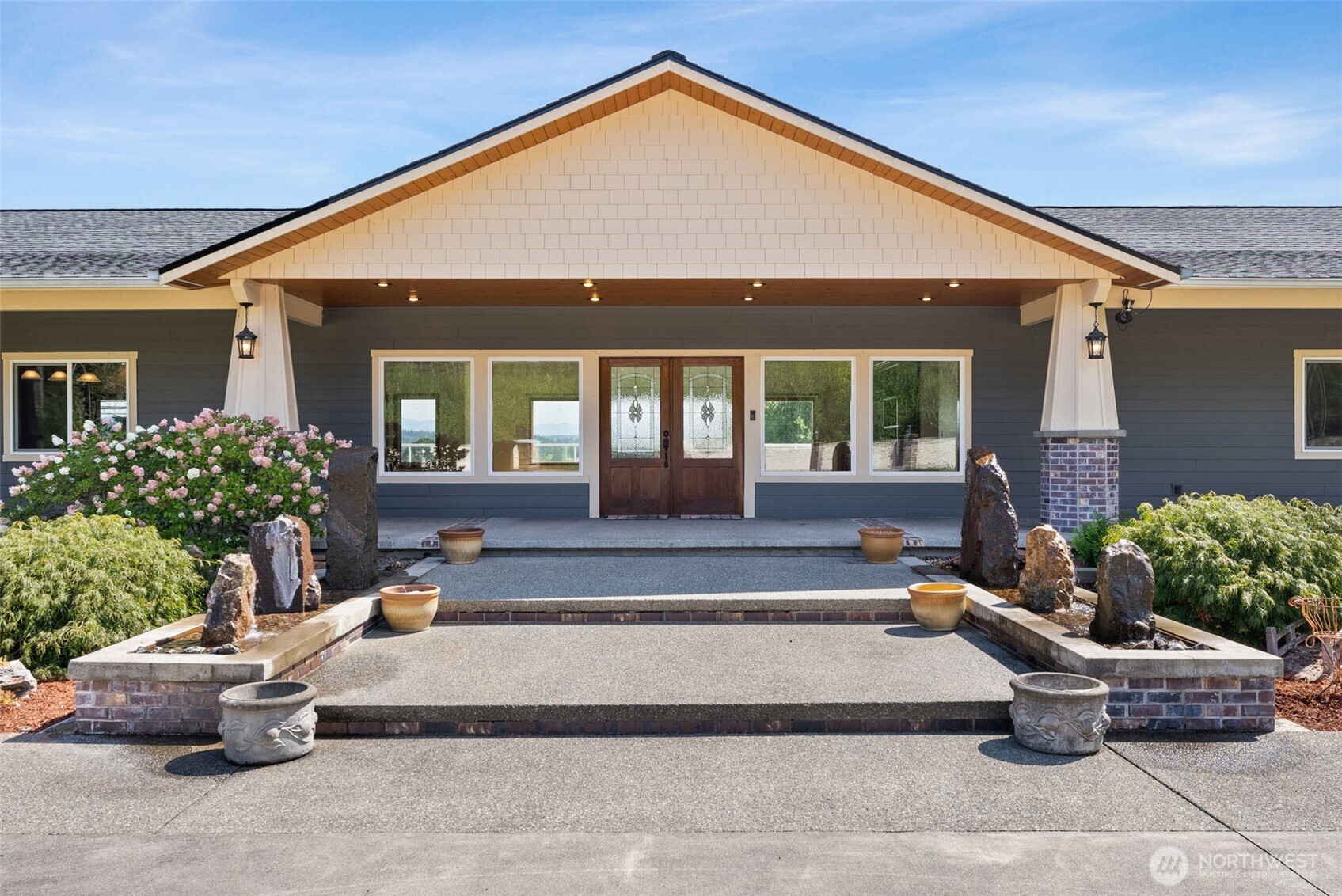 Discover the ultimate country retreat on just shy of 10 acres, where remarkable craftsmanship, expansive spaces and stunning Mt. Rainier views come together to create an exceptional property. Custom built by a contractor with an emphasis on quality, this one-of-a-kind home is designed for everyday living and unforgettable gatherings. The impressive entertaining layout offers room for everyone, with a gorgeous kitchen, living area, and wet bar upstairs and downstairs a custom one of a kind recreation/game room, partially finished theater room, another finished room and family room. Step outside to the expansive deck with sleek tempered glass railing and take in the peaceful surroundings while enjoying your favorite beverage or hosting a crowd.The property is equally impressive outdoors, featuring a new roof, 3 car garage, two gigantic shops with expansive gravel yard area perfect for construction vehicles and equipment, pasture for all the animals, garden area, chicken house, well, septic and a beautiful fish pond with cascading waterfall. Fountains welcome you at the entrance, setting the tone for the thoughtful details found throughout.  Whether you're looking for room for animals, space for your business, hobbies, a spectacular place to entertain, or a peaceful retreat with stunning views, this property delivers. A remarkable opportunity to create your own private gathering place for holidays, celebrations and all of life's special occasions. Napavine or Chehalis schools.