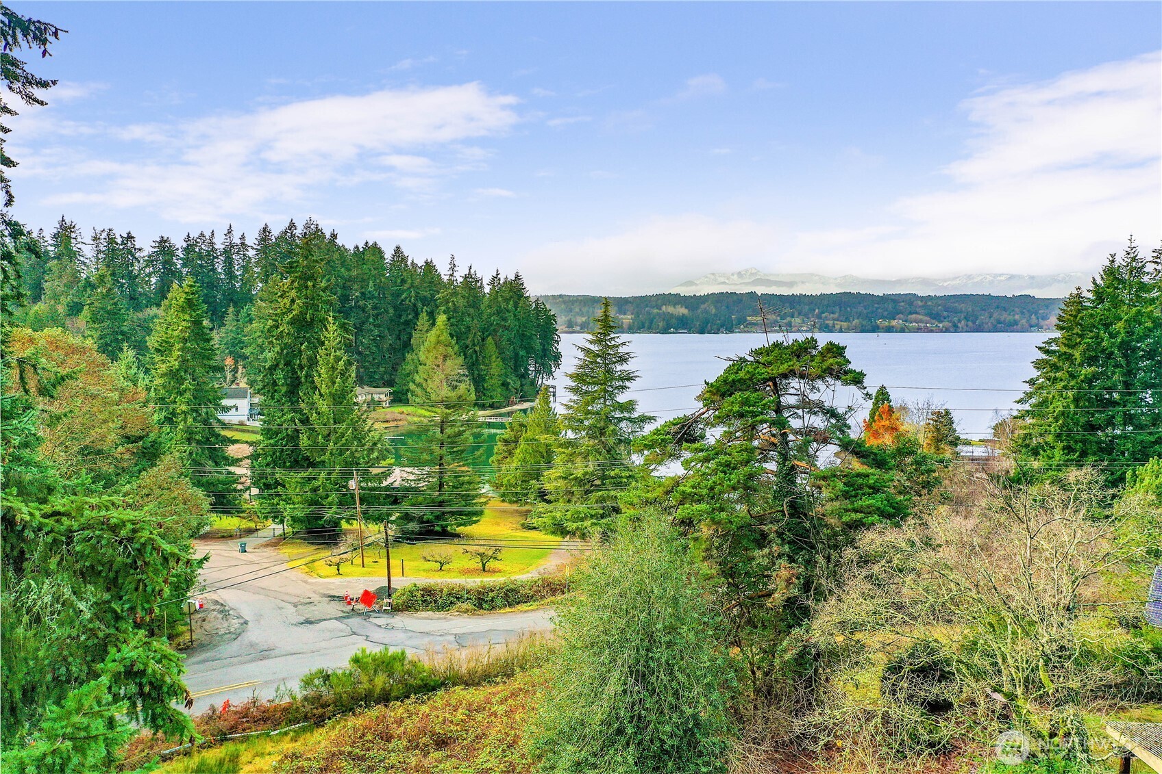 Soak in sweeping views of Liberty Bay and the Olympic Mountains from this incredible 2.8-acre parcel tucked away in one of Poulsbo’s most sought-after areas. With privacy, infrastructure, and potential already in place, including a 3-bedroom gravity septic (2010), shared well, power, and driveway, this property is ready for your vision. Whether you’re planning a custom home or exploring investment options, the existing mobile home adds bonus flexibility. Owner Financing Available. Just minutes to downtown Poulsbo and the Bainbridge ferry, this location offers both convenience and serenity. Reimagine, rebuild, or rent, your Liberty Bay dream starts here!