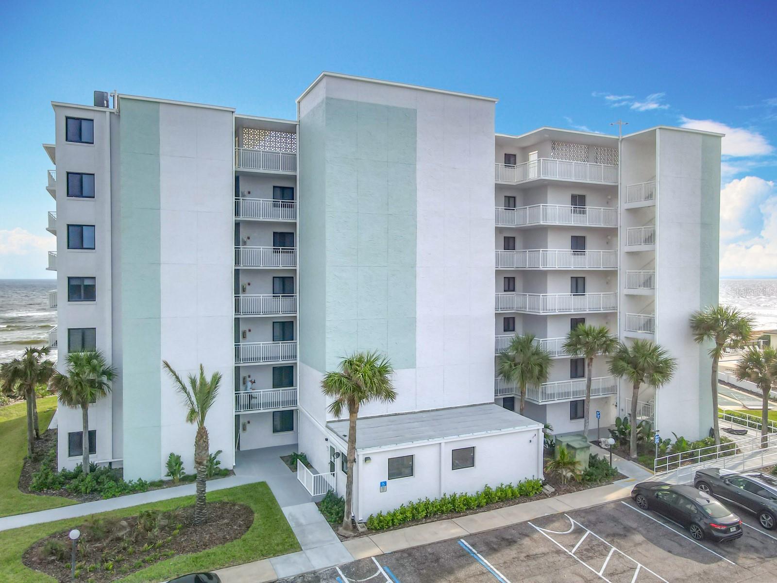 PRICED BELOW RECENT APPRAISAL! Welcome to your dream coastal getaway on the sought-after South No Drive Beach of New Smyrna Beach. This elegant two-bedroom, two-bath condo offers captivating sunrises from a spacious corner balcony, ideal for relaxing mornings and scenic evenings.Fully furnished with a beautiful coastal design, this turn-key residence is ready for you to move in and start enjoying. Plus, with short-term rental potential, you have the opportunity to earn income while owning your own slice of paradise.Located in the fully restored South Building of Shorehom By the Sea, this condo offers modern amenities within a vibrant beachside community. Don’t miss the chance to secure a valuable investment and create unforgettable memories.