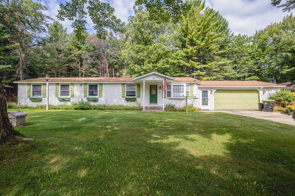 Welcome to this spacious ranch-style home offering the perfect blend of comfort, functionality, and location. Situated in a friendly neighborhood with plenty of foot traffic, this property features oversized bedrooms, an open and inviting layout, and versatile living spaces to suit a variety of needs. The standout feature is the private mother-in-law suite, complete with its own entrance and separate laundry hookups, ideal for multi-generational living, guests, or potential rental income. Car enthusiasts and hobbyists will love the large detached 4-car garage, built just a couple of years ago, offering ample space for vehicles, tools, and toys. Enjoy outdoor living with a charming gazebo, perfect for relaxing or entertaining on warm Michigan evenings. With Lake St. Helen just minutes away, you'll have easy access to boating, fishing, and year-round outdoor fun.