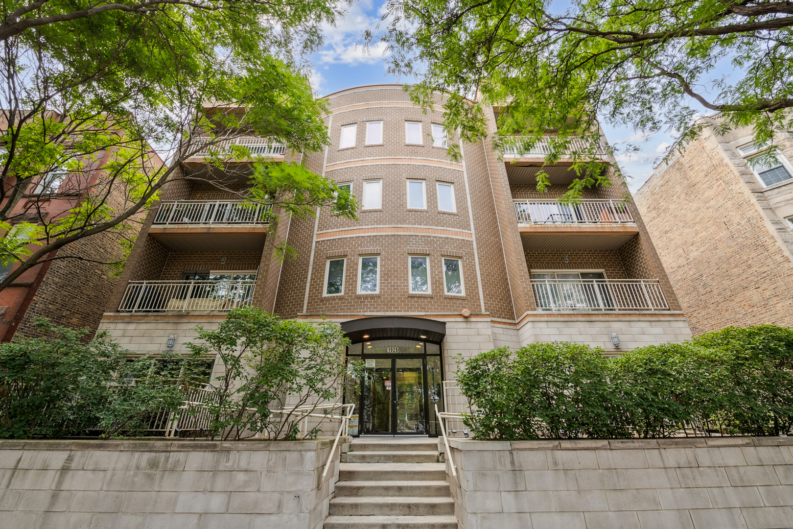 Welcome to this charming, move-in ready 2-Bedroom, 2-Bathroom home in an elevator building in an A+ Logan Square location! Beautiful Pergo laminate hardwood floors have been installed throughout the living areas and bedrooms! Cozy west-facing living area offers a gas fireplace and access to your balcony for enjoying afternoon sun and outdoor cooking! Kitchen offers shaker cabinets, granite countertops, tile backsplash, and stainless-steel appliances. Gracious primary bedroom can fit a king-sized bed and offers organized closets along with an en-suite bathroom featuring updated Edison bulb light fixtures and double-bowl vanity! Second bedroom provides the perfect work from home and/or guest room space accompanied by a full hallway bath! Secure outdoor parking space included, Brand new water heater! Newer full-size front load washer/dryer and Nest thermostat!  Excellent location within minutes of everything Logan Square: 606 Trail, Scofflaw, The Moonlighter, Parson's, Lonesome Rose, Bang Bang Pie, 90 Miles, The Freeze, the Blue Line CTA...the list is endless!