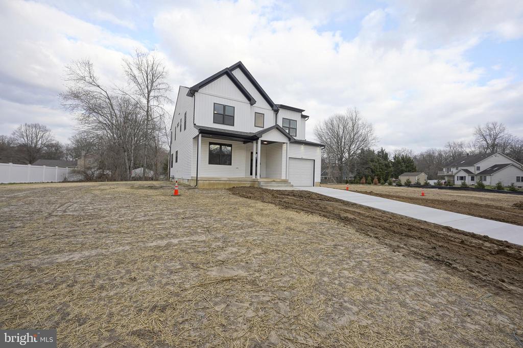 NEW Construction. WOW - Take a look at this gorgeous 4 bedroom 2.5 bathroom home with walkable crawl space and oversized garage. This home has beautiful curb appeal with modern black windows, white siding, black gutters and  oversized front porch. Entering the home you enter into the 2 story foyer with solid wood stairs to upstairs and custom metal railings. The main floor of the home boasts LVP flooring, an office, dining area, living room, half bathroom and kitchen. The kitchen features white shaker cabinets, tile backsplash, large island area, stainless steel appliances with stainless steel vent hood and beautiful quartz countertops. Upstairs are 3 spacious bedrooms, laundry room, and the owners suite. The owners suite has a huge walk in closet, a second closet and custom oversized bathroom. The owners shower is huge and also offers soaking tub. The owners bath also feature double vanity with quartz counters. This home  is situated on an oversized lot. This home is priced to sell and shows beautifully so make your appointment today before the sign reads SOLD.