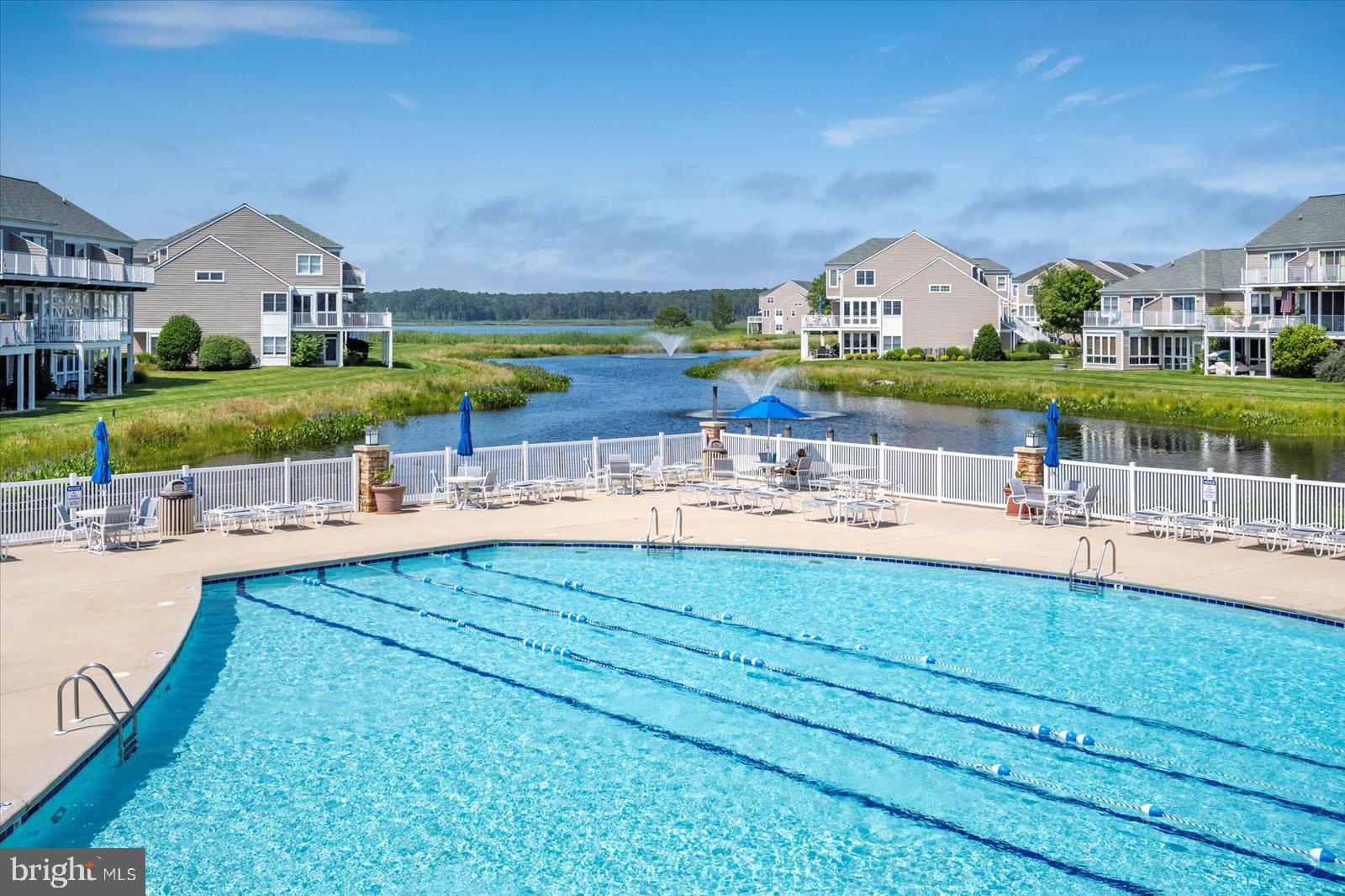 Incredible Opportunity at the New Price of $679,000 for 38277 Ocean Vista Dr #1180, a beautifully maintained fully furnished end unit townhome in the sought-after waterfront community of Bayville Shores in Selbyville, Delaware. Ideally located just 2.5 miles from Fenwick Island and minutes to Bethany Beach, Rehoboth Beach, Lewes, and Ocean City, MD, this Court Model offers over 2,650 sq. ft. of upgraded living space with a builder’s bump-out that enhances the open layout and natural light. As an end unit, it enjoys extra windows, added privacy, and unobstructed pond and bay views. The entry level features a spacious guest suite or second primary bedroom with a walk-in closet, en suite bath, and a bright waterfront sunroom perfect for a home office, den, or optional fourth bedroom. The main level showcases 9' ceilings, hardwood-style flooring, and a sun-filled kitchen with skylight, stainless steel appliances, abundant cabinetry, and bar seating. The dining area flows into the living room with gas fireplace and enclosed sunroom offering sweeping views of the pond and Little Assawoman Bay. Upstairs, the primary suite includes a walk-in closet, en suite bath with soaking tub and separate shower, and a private sundeck overlooking the water. A third bedroom with en suite bath and oversized closet completes the upper level. An attached garage provides extra storage, and the home is offered fully furnished with a stocked kitchen—ready for immediate enjoyment. Bayville Shores offers exclusive amenities for homeowners, renters, and guests secured via key fob access. Enjoy an Olympic-sized swimming pool, baby pool, sun deck, and centrally located Community Center with restrooms, showers, and on-site management. The second-floor fitness center includes cardio equipment, free weights, a Pilates bar, TV, kitchen, and community library with stunning pond views. Nature lovers will appreciate three freshwater fishing ponds (catch-and-release), three piers, and a private boat ramp with access to Dirickson Creek and Little Assawoman Bay. Kayak racks are available for seasonal rental, and a private boat storage facility accommodates vessels up to 30 feet. For recreation, there’s a full-sized basketball court, tennis court, four pickleball courts, shuffleboard, horseshoe pits, a sand volleyball court, and a playground. Scenic walking and biking paths wind throughout the neighborhood, with pondfront gazebos, a community post office, and golf cart-friendly roads. Water is included—so you’ll never receive a water bill—and the home is connected to public sewer. Enjoy low electric rates through Delaware Electric Cooperative. The HOA also covers all exterior maintenance plus flood and hazard insurance for low-maintenance ownership. Bayville Shores is partially solar powered, with panels generating over 1.5 million kWh of energy over 30 years. Short-term rentals are permitted, making this a high-performing investment property in a prime coastal location. With beautiful pond and bay views, spacious living, and unmatched community amenities, this turnkey home offers the best of coastal Delaware living.