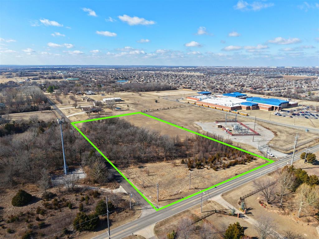 This premier 5-acre homesite offers an exceptional opportunity in a highly desirable location. Surrounded by beautiful custom homes, the property provides a peaceful rural atmosphere while remaining conveniently close to town amenities, schools, shopping, and major roadways.The land features a balanced mix of partial woods and open areas, creating versatile possibilities for your ideal layout—whether you envision a private homesite with room for gardens, outbuildings, horses, or simply expansive outdoor living.Per the applicable covenants and characteristics of the surrounding area, this parcel holds strong potential for essential commercial development (buyer to independently verify all zoning, restrictions, and feasibility with appropriate authorities).Seize the chance to build your dream home—or explore future investment options—on this rare and versatile piece of land. Don't miss out on this prime acreage ready for your vision!