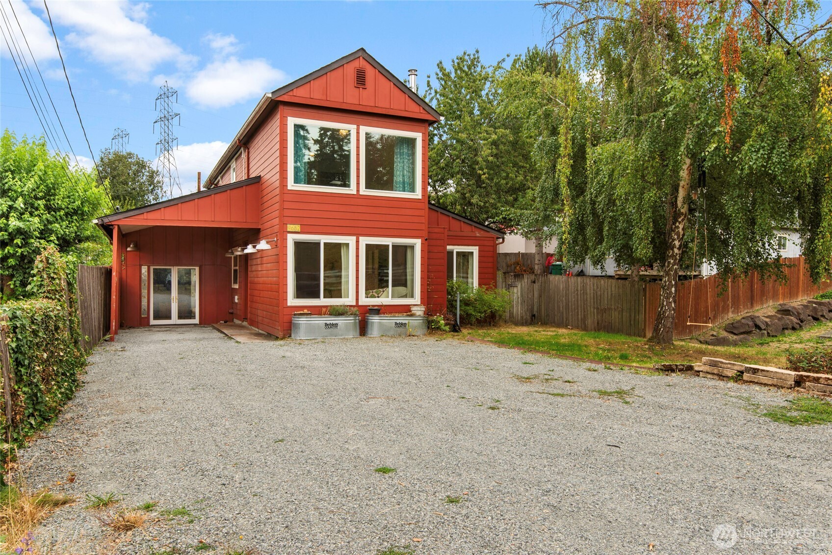 Beautifully maintained 3-bedroom, 2 bath home with bonus room for a 4th bedroom.  Home features original hardwood floors, vaulted ceilings,  living room next to formal dining room, updated kitchen with granite counters, stainless steel appliances, double oven, and wine/beverage refrigerator.  On the main level you will find a spacious bedroom, the bonus room & possible bedroom, the work studio or recreation / creative room.  Upstairs you will find 2 bedrooms; the primary and a spacious bedroom, 1 full bath with heated tile floors in bathroom off the primary.  Home features a tankless water-heater for improved efficiency.  Spacious backyard with a hot-tub, lots of space for entertaining, gardening and relaxing. Outbuildings include a wired shed for your convenience.  Prime location with access to Schools, Rainier Beach, Kubota Garden, Link Light Rail Station within walking distance, approx. 5 minutes to freeway and approx. 10 minutes to The Landing for shopping, dining, and entertainment.  Don't miss your chance to own this beautifully maintained home in a prime location!