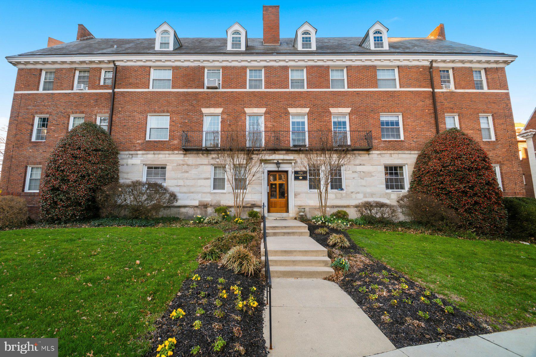 Oversized 3BR/2BA apartment located on the third floor of the beautifully maintained brick building in The Hamilton.  Step inside, make your way to the third floor, unit C3, and open the door to your forever home. Step into a home filled with natural light, high ceilings, original hardwood floors, crown moldings, and a warm color palette.  The main living area offers a spacious living room with a faux fireplace surrounded by built-in shelving and room for a dining table.  The kitchen boasts a banquet of cabinets with glass uppers extending to the ceiling, a butcher block countertop, a gas cooktop with a single oven below, a granite countertop with a tiled backsplash, and additional stainless steel shelving.  Adjacent to the kitchen is a full bath with a claw foot tub and laundry facilities.  Off the living room, through French doors, is the spacious primary bedroom. Down the hall are two sizable secondary bedrooms and a full bath with a walk-in shower.  This move-in-ready home offers new homeowners much to appreciate and is located close to shopping, restaurants, and commuter routes.