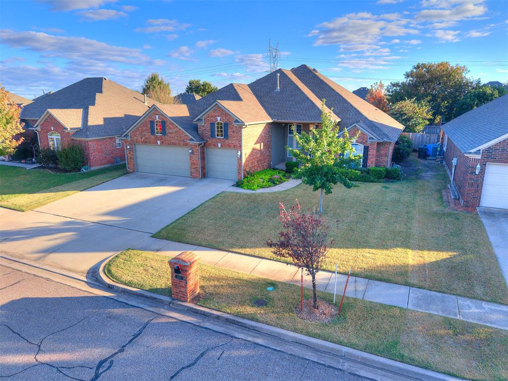 Welcome to this stunning 4-bedroom, 2-bathroom home with a dedicated study, offering 2,554 square feet of thoughtfully designed living space in the highly desirable Carrington Place neighborhood. From the moment you arrive, you’ll be impressed by the gorgeous curb appeal — mature landscaping, a welcoming entryway, and a well-maintained exterior that immediately sets the tone for what’s inside. Located just one block from the neighborhood pool and park, this home combines elegance, comfort, and convenience in one exceptional package. Inside, the split floorplan provides both functionality and privacy, with the primary suite tucked away from the secondary bedrooms. The spacious living room is the heart of the home, featuring a striking floor-to-ceiling stone fireplace that anchors the space and creates a cozy atmosphere for relaxing or entertaining. Large windows flood the room with natural light, highlighting the home’s warm tones and open feel. The dedicated study offers the perfect setup for working from home, with custom built-in bookshelves that add both character and practicality. Whether you use it as an office, reading nook, or creative space, it’s a room that inspires focus and comfort.  The primary suite is a true retreat, complete with a corner soaking tub, separate shower, and dual vanities — providing both style and functionality. The additional bedrooms are well-sized and thoughtfully positioned for family, guests, or flexible use. A storm shelter is conveniently located in the garage floor, offering peace of mind during Oklahoma’s stormy seasons. Plus, the HVAC system was replaced in 2025, ensuring efficiency and comfort for years to come. Carrington Place is known for its friendly community, tree-lined streets, and neighborhood amenities. With its unbeatable location near the pool, park, and easy access to shopping, dining, and schools, this home truly checks every box!