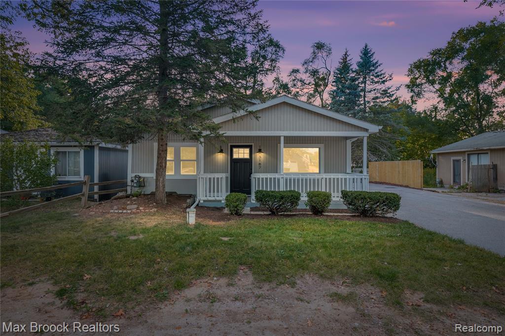 Better than remodeled, this RANCH home has been COMPLETELY REBUILT and feels brand new. It offers 3 bedrooms, 2 full bathrooms, and 1,328 sq. ft. of comfortable living space.Step inside to an inviting open floor plan featuring a spacious kitchen with a large island and included appliances, perfect for cooking and entertaining. Nearly everything has been updated, including a new well pump, bladder tank, air conditioning, furnace, appliances, bathrooms, and more—making this home truly move-in ready.The neutral décor throughout makes it easy to add your personal style. A skylight fills the main bathroom with natural light, while the unfinished basement offers great potential for additional living space, storage, or a custom design to suit your needs.Relax on the covered front porch with beautiful views of South Commerce Lake, and enjoy lake access for recreation and leisure. The large yard is perfect for gatherings, outdoor activities, or peaceful evenings at home.Conveniently located near shopping, dining, and everyday amenities, this home combines comfort with accessibility. It is also located in the Walled Lake School District, with Walled Lake Central High School just 1.5 miles away.