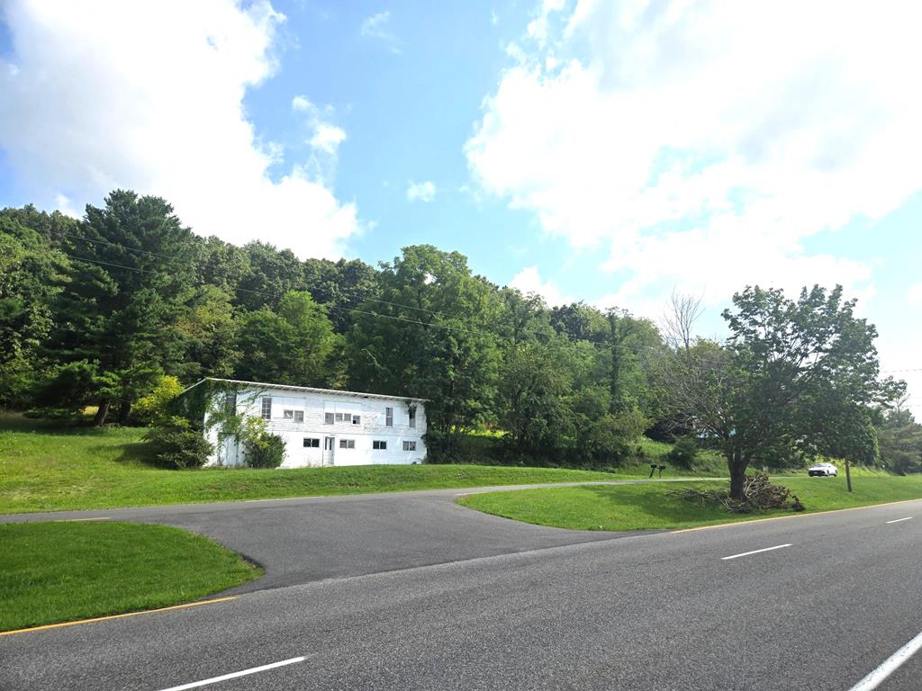 Attention investors 12 plus acres zoned B2 in town, with high visibility, endless possibilities for business and apartments, ect.  Proberty also has mature trees and long range views.  Older structure on property could be rehabbed.  GIS map shown may not be correct.