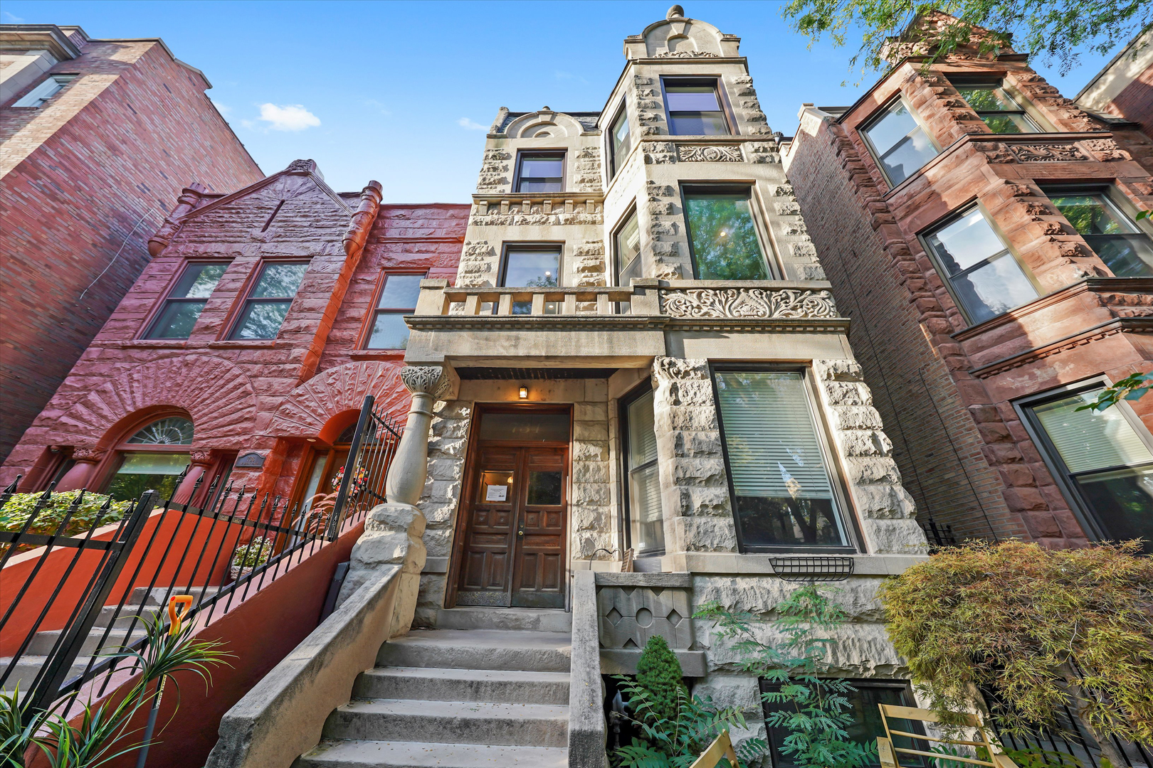 Welcome home to this beautifully updated 2 bed 2 bath condo on the top floor of a classic Chicago greystone in the heart of East Lakeview. This home perfectly blends vintage charm with modern updates, featuring elegant chandeliers, detailed molding, stunning millwork, and built-in shelving. A rare find for natural light lovers, the living room has bay windows with southern exposure. The second bedroom window is elevated above the neighboring roof for wonderful afternoon light. The separate formal dining room opens to a kitchen with white cabinets, granite countertops, stainless appliances, and a large island. Both bedrooms are ensuite. The extra-large primary suite fits a king bed plus a sitting area or office and includes a bonus room with a window that can serve as a walk-in closet or mini office. The primary bath features beautiful finishes and a large walk-in shower. The second bath can function as a private ensuite or freestanding, ideal for guests. A spacious laundry room provides extra storage, and there's also a 6x10 private storage room. Enjoy a back patio with space for grilling and dining plus a common garden patio overlooking a tree-lined street. Two tandem parking spaces included. Recent updates include water heater (2023), all new windows (2021), hvac (2021), and tear-off roof (2018). With very low assessments, this home is truly move-in ready. Unbeatable location-just steps to the Lakefront Trail, Belmont Harbor, Diversey Driving Range, and the dog beach, with easy access to Lake Shore Drive and the CTA. Walk to  Target, Mariano's, Whole Foods, Trader Joe's, gyms, and all the dining, shopping, and entertainment East Lakeview has to offer. Explore the property in 3D! Click the 3D button to take a virtual tour and walk through every detail.