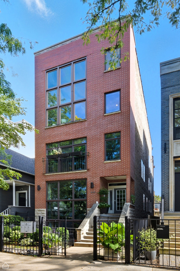 FULL 4K VIDEO TOUR OF THE HOUSE AND AREA ON VTOUR BUTTON, MAKE SURE TO CHECK OUT. Stunning Penthouse Duplex with two private outdoor spaces in HOT Bucktown/Wicker Park location. The 3-bed/2.1-bath condo features a breathtaking two-story open concept living/dining/kitchen with dramatic floor-to-ceiling windows and wood burning fireplace. Kitchen features stainless steel appliances including gas range, granite countertops, and lengthy peninsula perfect for entertaining. Main level additionally features two full-sized bedrooms with ensuite Jack and Jill bathroom as well as laundry/utility room, additional half bath, and private deck! Upstairs features lofted library/office space as well as large primary suite with custom walk-in closet, large terrace with sweeping city skyline views, and designer ensuite bath with dual sink vanity, soaking tub, and separate walk-in shower. Condo unit additionally features hardwood floors throughout, iron railings, custom built-ins, and wainscoting. Garage parking is included in the price! Unbeatable location in the heart of Bucktown, short distance to 606 trail, Damen/Milwaukee/North Avenue, and all the restaurants and retail that the neighborhood has to offer! Rentals allowed - 1 year long - Tax - 11,728.30; HOA - 322.50; Reserves - 7,261.42. Appliances - 2018 (Dishwasher 2022); Water heater from 16; AC and Furnace from 2018. Roof is from 2013 (full tear off); Full tuckpointing and sealing 2019; reserves 7,261.42 w/ no planned specials.