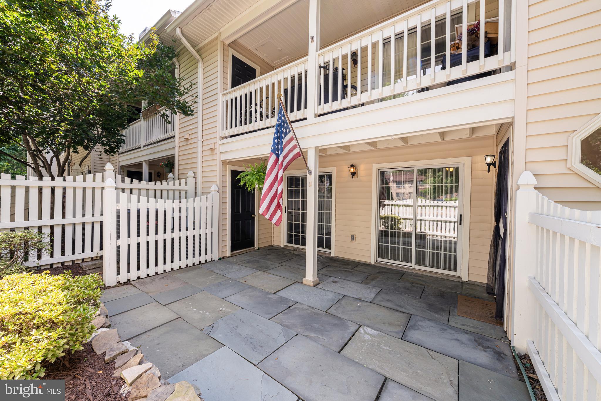 A rare opportunity to enjoy true indoor-outdoor living in a Northern Virginia condo. This ground-level, two-bedroom residence features a private, fenced stone patio with direct access from both bedrooms—an uncommon find that offers space for morning coffee, container gardening, entertaining, or relaxing outdoors with a pet.The home is also exceptionally positioned for convenient everyday living and commuting. Located near I-66 and the Vienna/Fairfax-GMU Metro Station, it offers easy access to Downtown Vienna, Oakton, Fairfax, and Tysons Corner, along with nearby shopping, dining, parks, dog parks, and the W&OD Trail.Inside, the main living area is centered around a wood-burning fireplace and flows naturally into the dining space, creating a comfortable setting for relaxing or entertaining. The updated kitchen features engineered quartz countertops, a tile backsplash, and LG appliances, while a nearby laundry closet with a GE Profile washer and dryer adds everyday convenience.The primary bedroom includes a walk-in closet, direct access to the full bathroom, and sliding glass doors opening to the patio. The second bedroom also offers direct outdoor access and can easily serve as a guest room, home office, or flexible living space.Outside, the private stone patio is enclosed by a wood fence with a gated entrance and bordered by flower beds, creating a peaceful extension of the home. With no stairs required to enter and outdoor access directly from the unit, this residence offers a level of accessibility, privacy, and functionality rarely available in condo living.Located within the Oakton Elementary, Oakton Middle, and Oakton High School pyramid, the home is convenient to Blake Lane Park, Borge Street Park, Oakton Community Park, Oakton Shopping Center, nearby dog parks, Metro, and major commuter routes. 10198A Ashbrooke Court, Unit 125 combines a distinctive ground-level setting with exceptional access to some of Northern Virginia’s most connected destinations.”