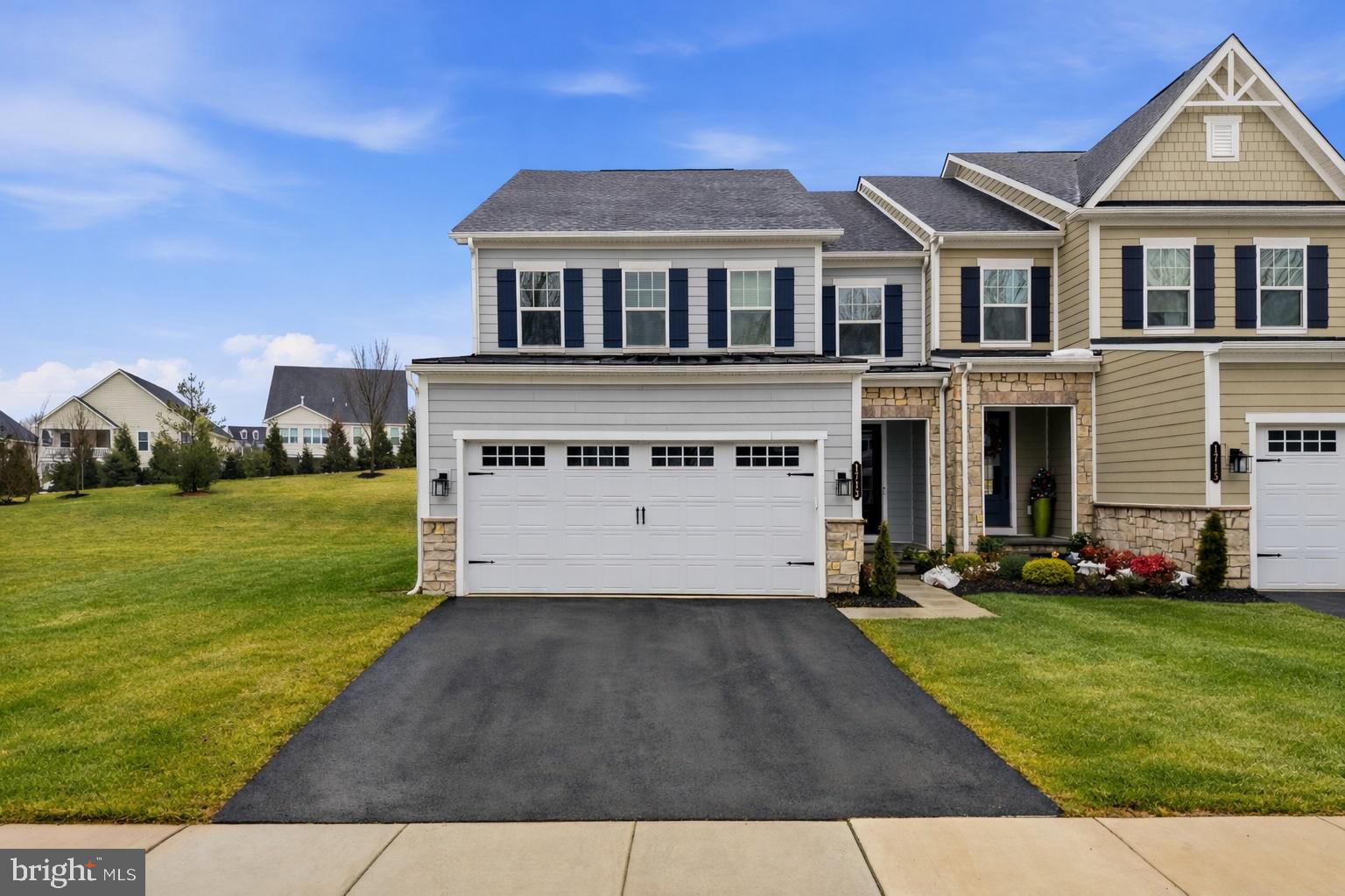 Skip the complexities of new construction and step effortlessly into this refined, turnkey Haverford model twin carriage home by NVHomes, completed less than two years ago. Ideally positioned on a premium corner lot within the highly desirable Greystone community of West Goshen Township, this sophisticated residence offers over 3,500 square feet of beautifully curated living space across three finished levels.From the moment you arrive, the home’s striking curb appeal and inviting front entry make a lasting impression, enhanced by the privacy and presence afforded by its corner setting. Inside, a gracious foyer welcomes you into an open-concept design accented by elegant millwork, thoughtfully selected designer finishes, and extensive upgrades throughout.Just off the foyer, a versatile flex space offers the perfect setting for a home office, formal living room, or refined dining area. The heart of the home is the chef-inspired kitchen, showcasing crisp white cabinetry, quartz countertops, stainless steel appliances including a gas cooktop and wall oven, under-cabinet lighting, and a generous center island ideal for both entertaining and everyday living. A large walk-in pantry adds both style and function, while pendant and recessed lighting elevate the space. The adjacent sun-filled dining area opens seamlessly to a composite deck, creating an effortless indoor-outdoor lifestyle.Flowing naturally from the kitchen, the spacious family room provides an inviting setting for gathering and relaxation. A beautifully appointed powder room and a custom mudroom with built-in storage complete the main level, blending luxury with everyday practicality.Upstairs, the primary suite is a serene retreat, featuring a tray ceiling, two walk-in closets, and a spa-like bath with an oversized dual quartz vanity, private water closet, and a luxurious walk-in shower with built-in bench. Two additional bedrooms offer generous proportions and share a well-designed full hall bath, while a spacious loft provides flexible living space—ideal for a second lounge, playroom, or creative retreat. A conveniently located second-floor laundry room adds ease to daily life.The fully finished lower level offers exceptional versatility, complete with a fourth full bathroom and expansive space suited for a media room, home gym, guest suite, or additional living area.Fully upgraded, lightly lived in, and impeccably maintained, this exceptional corner-lot home offers the perfect blend of luxury, comfort, and convenience. Just minutes from West Chester Borough, you’ll enjoy easy access to acclaimed dining, boutique shopping, scenic parks, and major commuter routes.