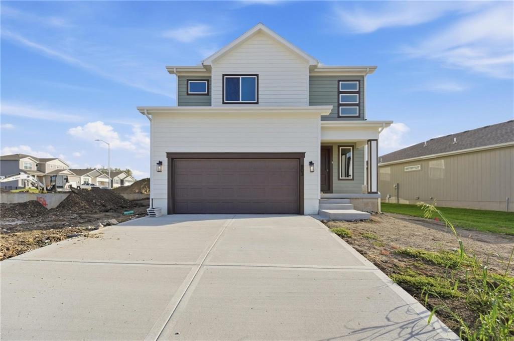 Move in Ready!!! Traditional farmhouse exterior & functional design create a home that's both efficient and beautiful!  A soaring 2-story foyer with beautifully wainscoted walls welcomes you to an open & bright main level perfect for both quiet moments or group entertaining. The generous living room with stylish fireplace wall flows seamlessly into the dining and kitchen areas where a large island & walk-in pantry, along with abundant soft-close cabinetry & designer  finishes add a touch of luxury.  Tucked privately in back, a primary suite with stunning trimmed accent detail offers a relaxing retreat with a well-crafted ensuite bath and large closet. Just off the garage, a convenient mudroom with built-in bench and adjacent laundry (connected to primary) keeps daily life organized and efficient. Upstairs, you’ll find three surprisingly large secondary bedrooms equipped with a walk-in closets, along with a large double-vanity full bath and a versatile loft area ideal for central study space, a play area or even a book nook. The open-to-below balcony design enhances the entry’s light and airy feel, while stepping outside to the large covered patio you'll find the spot for relaxing evening lounging and outdoor dining. The home is equipped with energy-efficient lighting, high efficiency HVAC and water heater, Low-E windows, soft-close cabinetry throughout, fully insulated garage and the confidence of 1/2/10 year warranties. Think about adding a 940sqft lower level finish with a 5th bedroom, 4th bath, and large rec room to make this home 3120sqft total!  Located in sought-after Creekmoor, residents enjoy a championship golf course, the best clubhouse and amenities complex in KC with 3 pools, a fitness center, tennis/pickleball/basketball courts, walking trails, stocked lake, convenient access to shopping, dining, & everyday essentials and more!