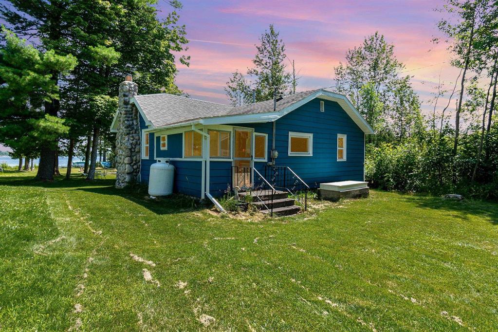 Heres your chance to own a piece of Sage Lake history-this well-kept 100-year-old cabin sits right on the shores of one of the areas most popular all-sports lakes. The yard is level to the water, so no steps or hills to deal with-just walk right out and enjoy the lake. Inside youll find 2 bedrooms, 1 bath, a fun loft area for the kids, and a cozy wood interior with vaulted ceilings. The 10x20 front porch is the perfect spot for morning coffee or winding down with a cold drink, all while taking in those beautiful lake views. New windows and a 12x16 shed were just added, and the cabin comes completely furnished-just bring your bags and start making memories. And when you dont feel like cooking, Kenyons Lakeside Resort is just down the road for great food and drinks. This is what lake life is all about. Cabin comes completely furnished