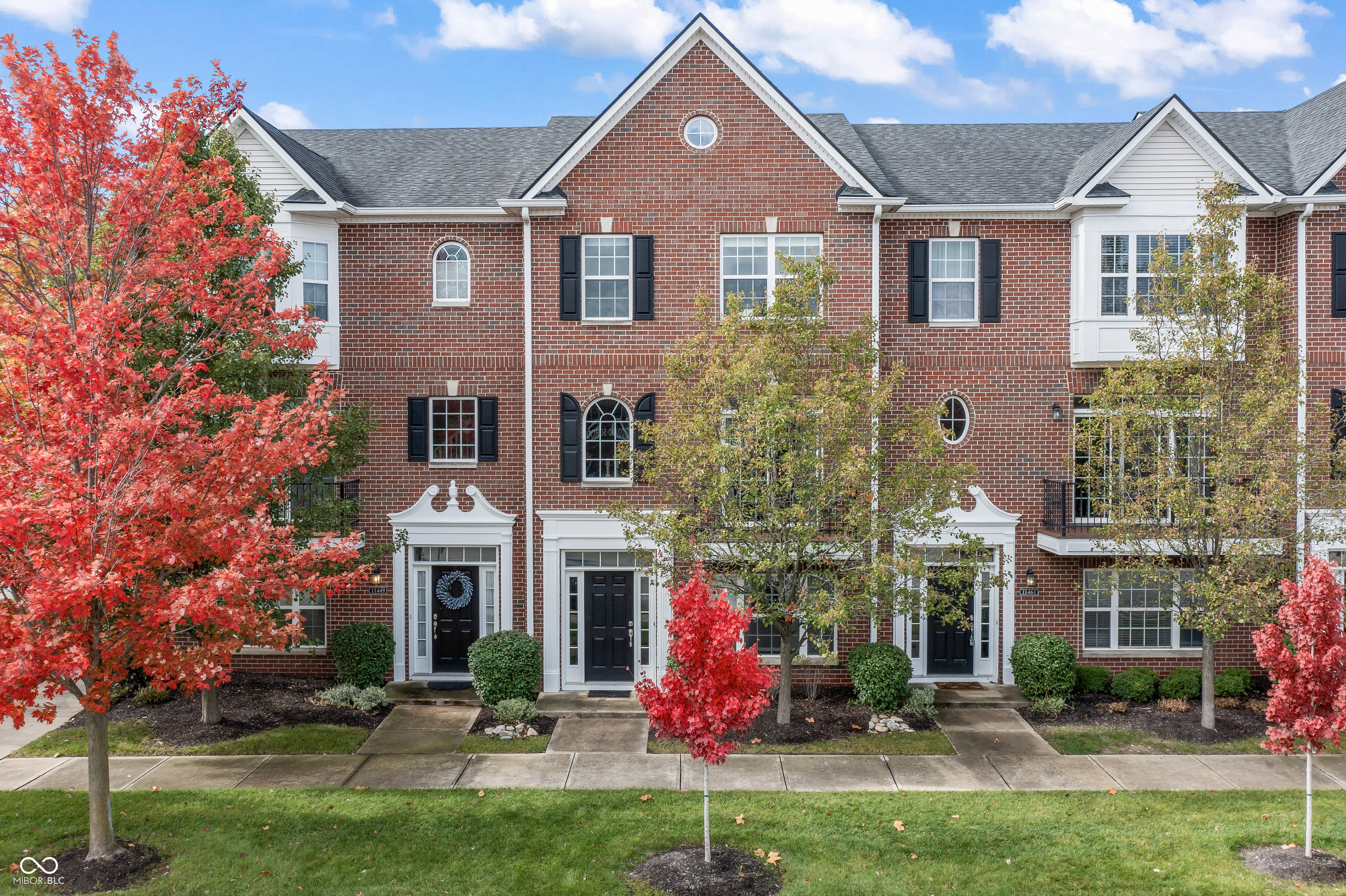 Welcome to this turnkey, beautifully updated 3-story townhome in the heart of downtown Fishers! A short walk to the Nickel Plate Trail, local restaurants, boutique shops, live summer concerts, and more, this location offers the ultimate blend of convenience and lifestyle. Inside, you'll find fresh interior paint throughout and newly installed modern black stair railings that elevate the home's contemporary feel. The main level features luxury vinyl plank flooring, while the upper level offers newly installed carpet. The kitchen shines with refreshed cabinetry, Corian countertops, a modern farmhouse sink, and stainless-steel appliances. A custom-built dining nook makes this kitchen truly one-of-a-kind-perfect for morning coffee, casual meals, or hosting friends. This spacious three-level floor plan offers flexible living options for a home office, guest suite, or additional entertainment space. The primary suite impresses with an updated bathroom featuring marble countertops, new cabinetry, and a walk-in shower. Step outside to enjoy a low-maintenance rebuilt composite deck-ideal for relaxing or entertaining. Furnishings and decor are included with the sale, making this stylish condo completely move-in ready. With a newer roof and a host of thoughtful upgrades, this home combines modern comfort, function, and downtown Fishers living at its best!