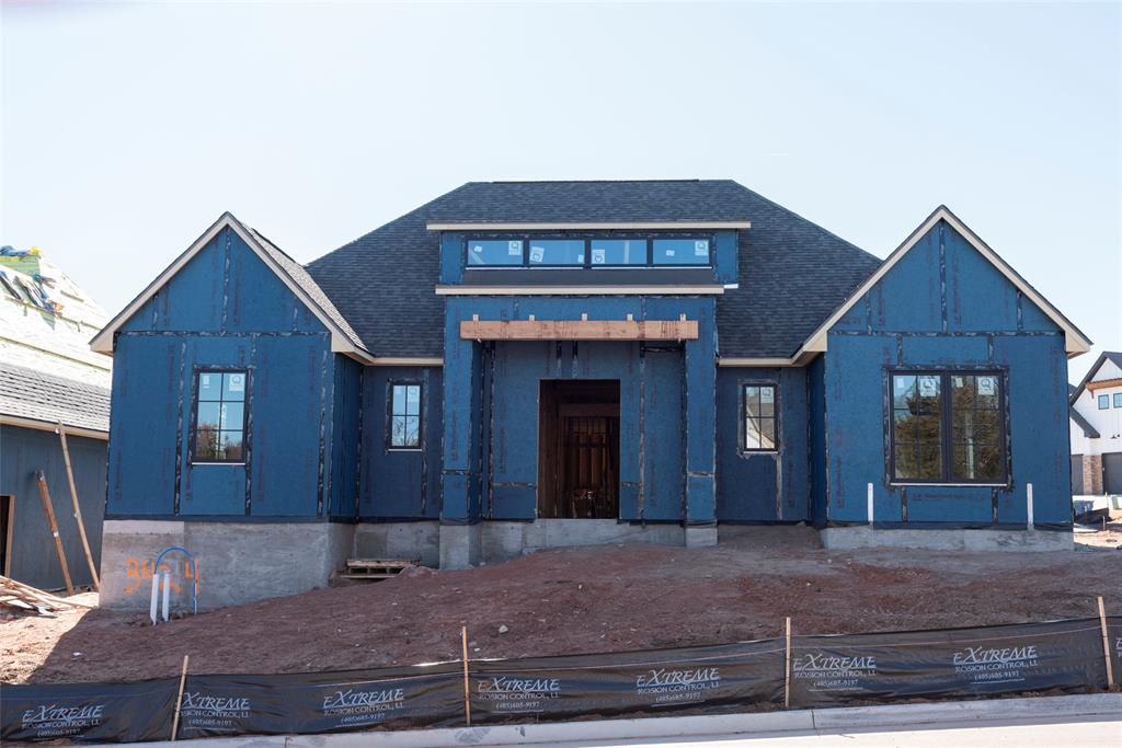 Located in Cross Timbers, this new construction home offers a well-planned 3-bedroom, 2-bath layout with thoughtfully selected finishes throughout. The entry opens to beam details, curated lighting, and wide plank flooring that continues through the main living spaces. The living room is centered around a statement fireplace with rich tile and a custom mantle. The kitchen features natural wood tones, and a clean, functional layout suited for both daily living and entertaining. A dedicated office and built-in study nook provide flexible space for work or homework, while the mudroom and laundry area are thoughtfully planned with custom cabinetry and patterned tile. The primary suite is privately positioned with refined finishes throughout. One secondary bedroom features a board-and-batten accent wall, while the other is highlighted by an accent-painted ceiling. An oversized two-car garage offers generous storage and everyday practicality. Roofing includes Class III impact-resistant shingles for added durability.