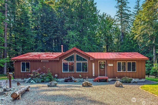 You have to see this incredible property! Beautiful open-concept home located on 1 acre, in a gated community in Packwood. This stunning 3-bedroom, 1¾-bath home features gorgeous true wood touches throughout, vaulted ceilings, and impressive 36" wooden doors that add warmth and character. Large windows fill the home with natural light while showcasing wonderful surrounding views. The spacious layout includes an inviting living area, dining room, and a kitchen perfect for entertaining or relaxing after a day of outdoor adventure.  The outdoor amenities make this property truly exceptional a fully equipped outdoor kitchen with power, propane, storage, and water, plus a gazebo dining area and fire pit for gatherings. Additional features include a shop, bathhouse with shower and vanity, implement storage shed...all on this beautifully maintained one acre! Ideal for guests or recreation, the property offers two RV hook-ups: one full hook-up with dump and 30/50-amp service and a second with 30-amp power and water. Located just minutes from Packwood and Hwy 12, this property provides easy access to year-round outdoor activities including, hiking, skiing, biking and fishing. the community also features a scenic walking path to the Cowlitz River and community water for $32 mo or pay yearly. This truly has it all!!!