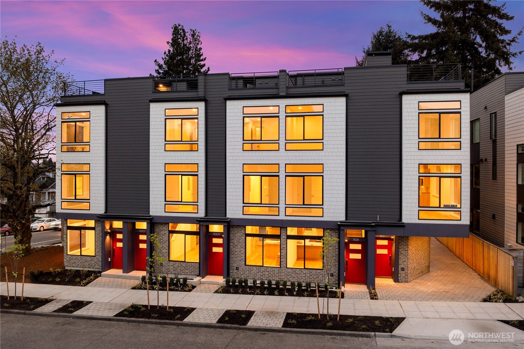 Lender paid rate buy down available - ask for details! Discover a rare opportunity to own a beautifully designed new home ideally positioned between Green Lake and Roosevelt, offering an exceptional combination of location, walkability & modern living. With a 92 WalkScore, enjoy morning strolls around Green Lake, neighborhood cafés, acclaimed restaurants, Whole Foods & Link Light Rail providing convenient access to the University of Washington, South Lake Union, Downtown Seattle & Bellevue. Thoughtfully designed, the bright open-concept floor plan is filled w/natural light from expansive windows. At the heart of the home, the chef-inspired kitchen showcases quartz countertops, premium Fisher & Paykel appliances w/gas stove, sleek contemporary cabinetry. The private upper-level primary suite offers a spa-inspired retreat, while flexible living spaces easily accommodate guests, a home office, or changing lifestyle needs. Expansive rooftop deck extends your living space outdoors: perfect for entertaining, summer BBQs, or relaxing. Enjoy a fully fenced, beautifully landscaped courtyard featuring a mature tree and inviting seating, creating a private outdoor retreat for residents to relax or garden. Not a condominium. NO HOA dues. Photos are of different home w/same color scheme to showcase the quality and finishes throughout.