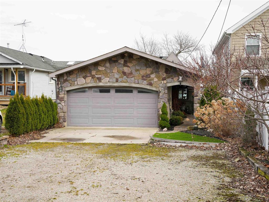 Looking for a getaway to call home? Anxious to sit in your backyard, enjoy the water, fish, and watch the freighters pass by? This is a beautiful home located on the St. Clair River, and set inside a large sized lot. The home has custom designed and built in large windows to provide a perfect view of the waterfront. The entire home has been recently updated and is ready to move in. This home sits off a private and quiet road, has a long driveway, attached garage, and multiple spaces for your house guests or family. With two master suites, a large open living room, and beautiful kitchen, you'll be able to enjoy views of the water throughout the home. This home also has an outdoor brick patio area perfect for entertaining all summer long, as well as a garden area, storage shed and beautiful, simple, easy to upkeep landscaping. On the waterfront, you have access to your own personal boat hoist with quick, easy access to the River.