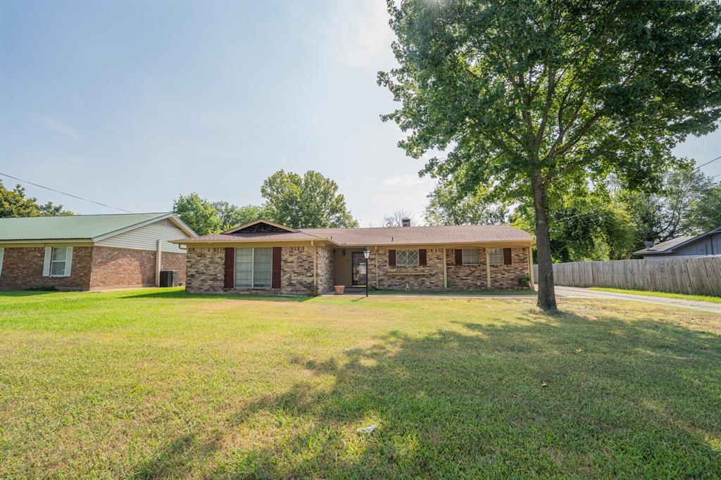 Come check out this 3 bedroom 2 bathroom home in Sulphur Springs. An extra family room can be used as a fourth bedroom, a space for entertaining, game room or more. The kitchen offers a nice range, dishwasher and double bowl sink. The utility room is tucked away off the kitchen. The primary suite is at the end of the hall and has a ensuite bathroom and walk-in closet. Outside you have a spacious patio for relaxing and a nice backyard. This house is on a street tucked away with little drive by traffic.