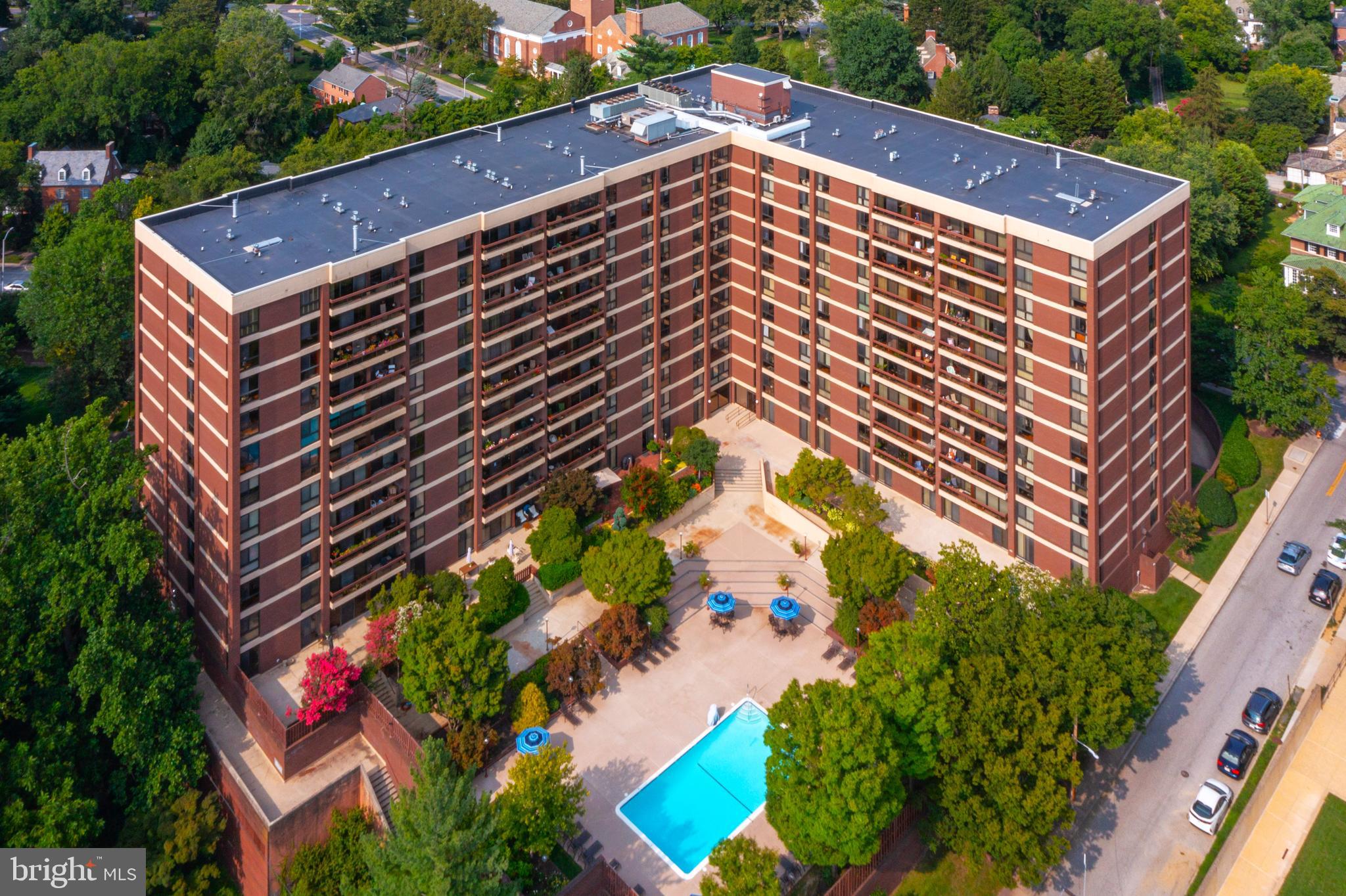 Come visit this lovely, freshly-painted condominium home with hardwood flooring (not parquet) and an open floor plan. Bedrooms are carpeted. This unit has two bedrooms, two updated baths and AMAZING VIEWS from your balcony… all the way to the water! Enjoy a modern kitchen with tile flooring and under-cabinet lighting. Two sets of replaced sliders, and a sweet  view from your east-facing balcony. This home is also equipped with a front loading stacking washer/dryer combo, assigned deeded parking space, and storage locker. Condo fee includes heat, hot water, central A/C, building maintenance & more (excludes Wi-Fi and cable). Winthrop House amenities: 24/7 doorman & concierge, on-site maintenance & property manager, outdoor pool & fitness center, sauna, meeting/party room, guest suite for visitors, and then location, location, location! Just a short walk to Johns Hopkins University, the Baltimore Museum of Art, Gertrude’s Restaurant, Sherwood Gardens, and countless local cafes, shops, and amenities. Don’t miss this rare opportunity to live in one of Baltimore’s most convenient and charming neighborhoods—with all the perks of a full-service building. This building is renowned for being well-managed with high reserve funds. The balconies are resurfaced and refurbished. The roof and elevators were recently replaced here. There is no anticipated special assessment. Ask the listing agent about this fantastic building. His Mom lives here! Love living here!