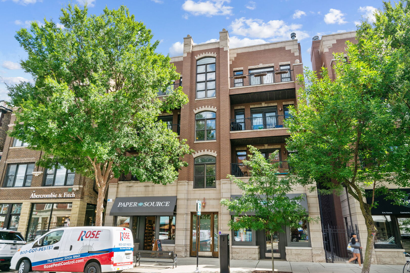 Oversized, 1700 sq ft penthouse with an enormous private roof deck and upper-level office and storage/utility room, in the heart of the Southport Corridor. Garage parking is included! The bright, wide-open living space, with a woodburning/gas fireplace, can easily accommodate a large sectional plus a full dining area. A charming treetop balcony off the living room is perfect for grilling, morning coffee and people watching on Southport. The updated white kitchen features a huge breakfast bar, LG and GE chef's appliances, a deep stainless sink and polished wood counters. The primary suite offers multiple organized closets and a large bathroom featuring a double vanity, whirlpool tub, and a separate steam shower. The spacious second bedroom can easily accommodate both an office area plus a guest bed, with a wall of organized closets. Other features include a laundry room with side-by-side washer/dryer, newer HVAC, and hardwood floors throughout. The upper level offers a second office, or space to house a beverage cooler and store entertainment needs. The adjacent utility room provides tons of storage space. The ENORMOUS roof deck spans the entire footprint of the unit, with space for multiple seating and dining areas. Add a TV to hear the cheers of the crowd while watching the Cubs game--the deck is 2471 feet to center field! Perfect for listening to concerts, too. And next summer, enjoy Taco Fest and other Lakeview events. All that the Southport Corridor offers is at your door or a few blocks away: boutiques, grocery, bars and restaurants, the Brown Line, and Wrigley Field!