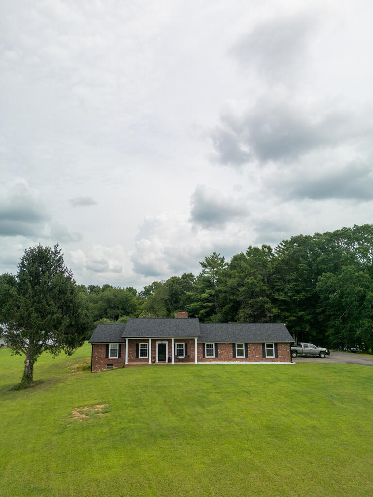 Beautifully updated 3 bedroom, 2 bath brick home offering a great combination of classic construction, modern updates, and convenient location! Ideally situated near Hillsville and Galax, with easy access to I-77, this home is a great option for both full-time living and those looking for a convenient Southwest Virginia location. The home has undergone numerous updates, including updated HVAC, updated plumbing and electrical, new appliances, cabinets, flooring, new interior doors and new countertops. The roof is approximately two years old, and replacement windows and sliding glass doors provide additional updates and comfort. Both bathrooms have been completely updated with the master featuring custom tile shower, adding a beautiful touch to the home's interior. New lighting throughout helps give the home a fresh, modern feel while maintaining the character of the brick exterior.