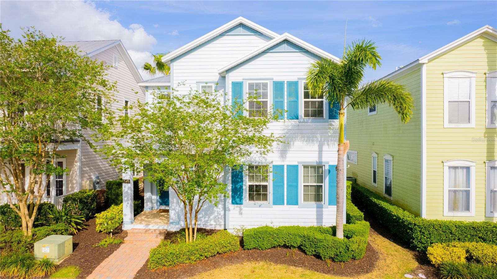 Beautiful Key West-style single-family home located in the desirable Patriots Landing at Reunion Resort. Perfect as a primary residence or a luxurious vacation retreat. This lakefront property has been used as a primary residence by its first and only owner and is exceptionally well maintained. This spacious property features 5 suites and an open floor plan that seamlessly integrates the living room, kitchen, and dining area, with pool views through expansive sliding glass doors. There is a convenient guest suite on the first floor, and the remaining four suites are located upstairs, including the primary suite, which offers a double vanity and double showers in the en-suite bathroom. Upstairs, you’ll also find a versatile loft area, ideal for use as a family or game room, as well as a laundry room with a sink and white cabinetry. The home includes several notable upgrades: High ceilings and tall interior doors Raised vanities in all bathrooms Two wet bars – one on the first floor and one in the upstairs loft – each with a sink, cabinetry, wine cellar, and ice machine Fresh exterior paint (completed 2 years ago) One new A/C systems installed 2 years ago Honeywell smart thermostat system controlling the entire home Durable metal roof with a 30-year life expectancy Located in Reunion Resort, a guard-gated golf community, residents enjoy access to three PGA-designed golf courses, scenic trails, seven resort-style pools, tennis courts, and a variety of fine and casual dining options. This home is being sold partially furnished.